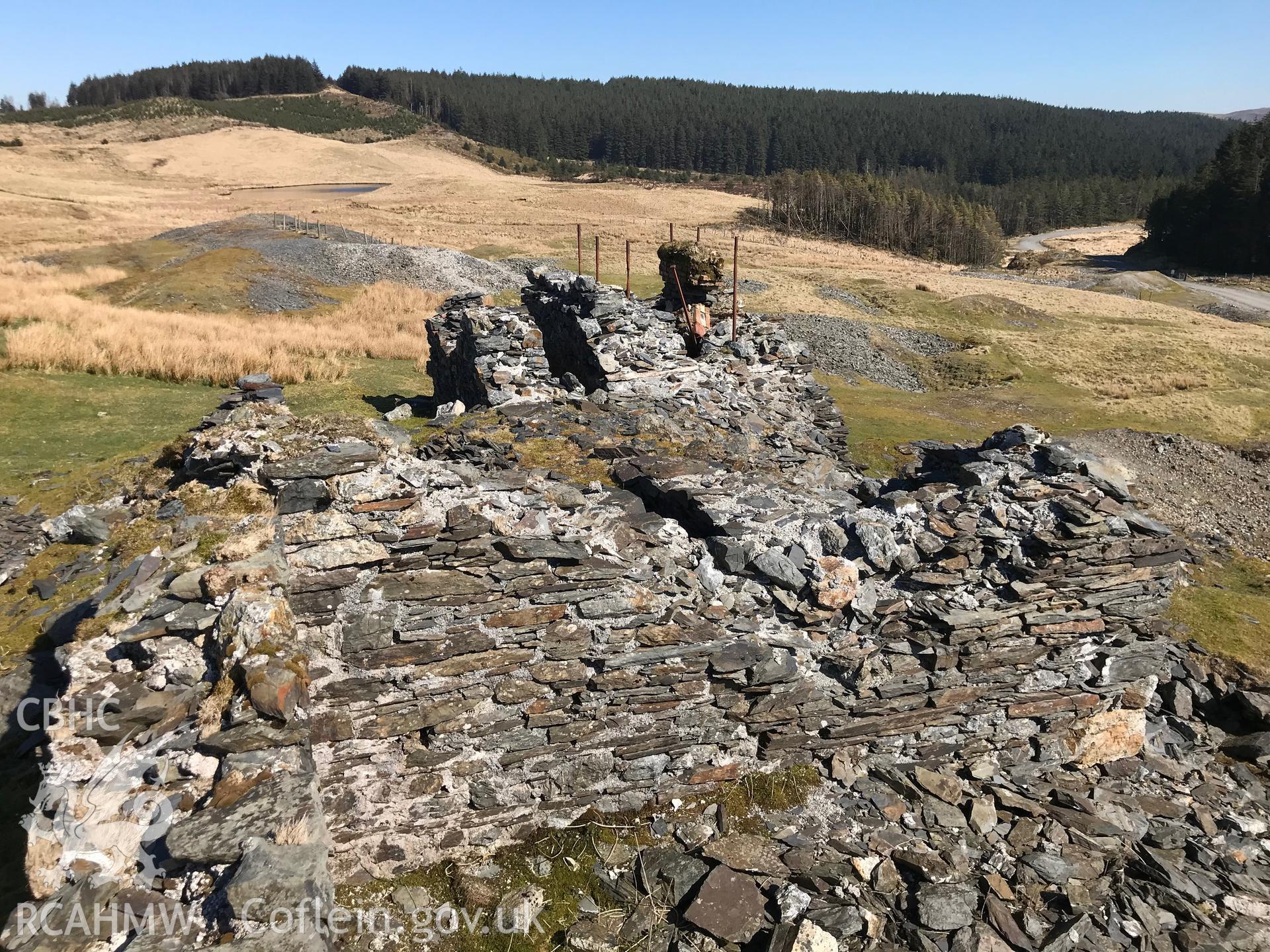 Colour photograph of earthworks at Esgairhir lead mine engine house, east of Tre Taliesin, Aberystwyth, taken by Paul R. Davis on 29th March 2019.