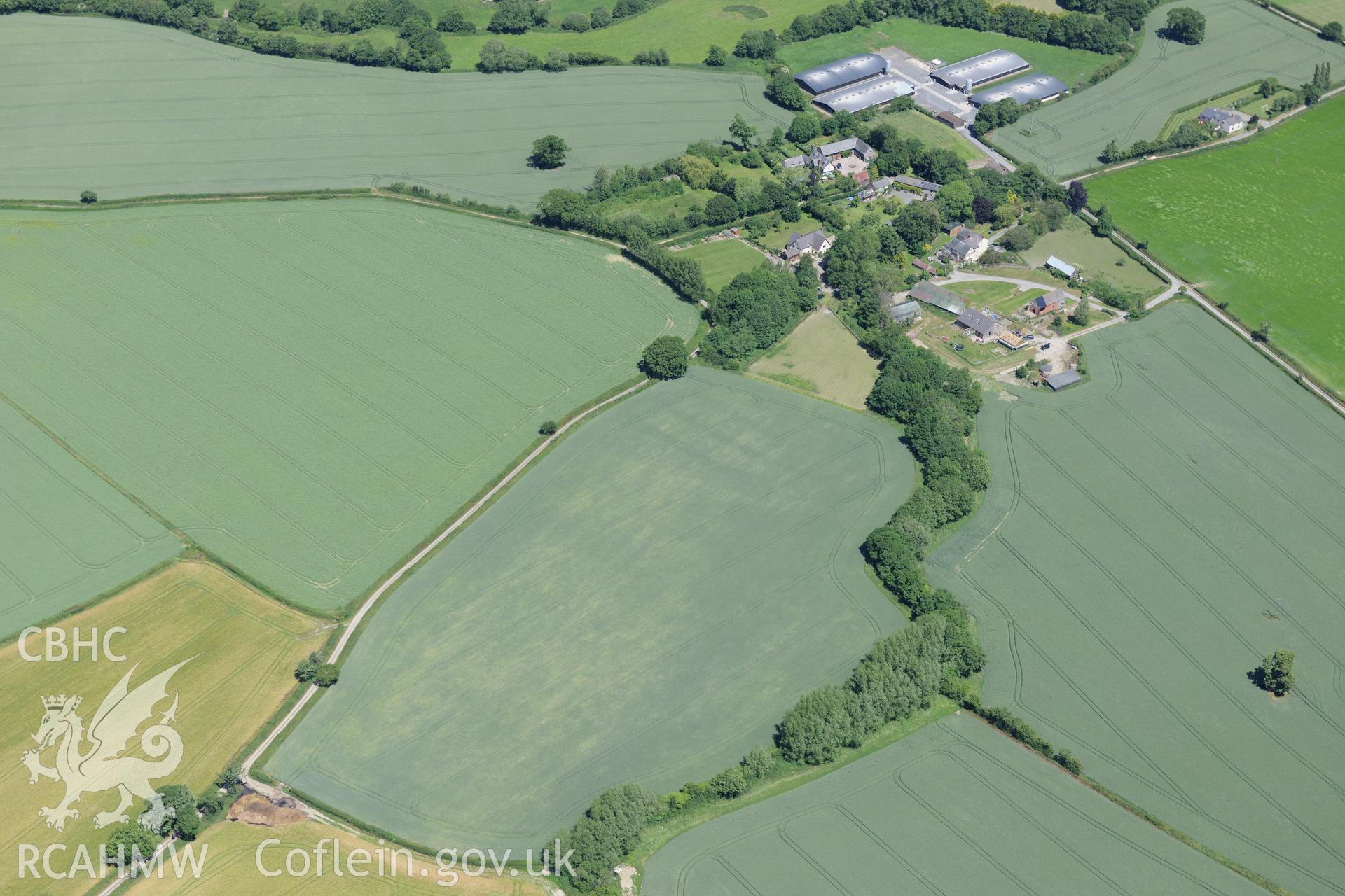 Bacheldre hall, farmhouse and defended enclosure, south of Montgomery. Oblique aerial photograph taken during the Royal Commission's programme of archaeological aerial reconnaissance by Toby Driver on 30th June 2015.