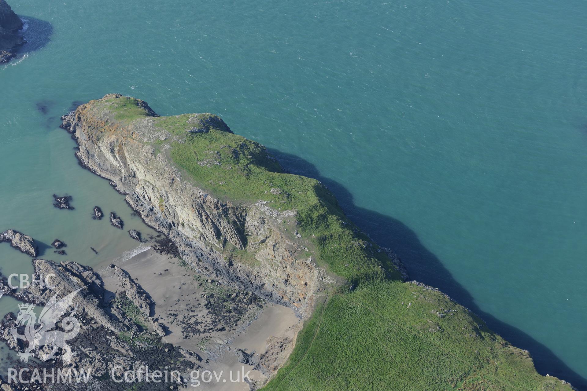 Porth-Egr promontory fort and the landing place at Culporth, north east of St. Davids, on the Pembrokeshire coast. Oblique aerial photograph taken during the Royal Commission's programme of archaeological aerial reconnaissance by Toby Driver on 30th September 2015.