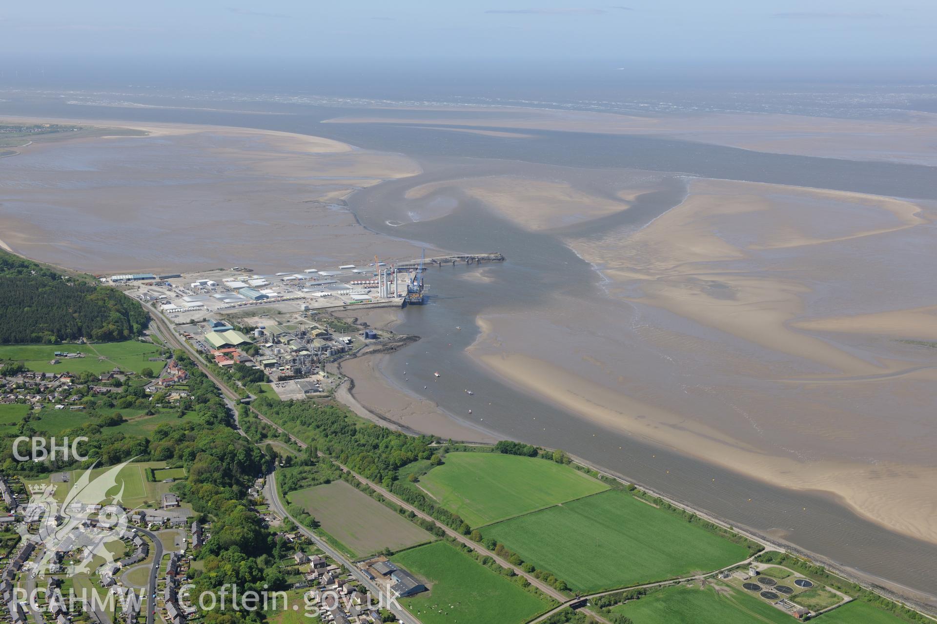 Mostyn Quay in the port of Mostyn, with windfarm parts. Oblique aerial photograph taken during the Royal Commission?s programme of archaeological aerial reconnaissance by Toby Driver on 22nd May 2013.