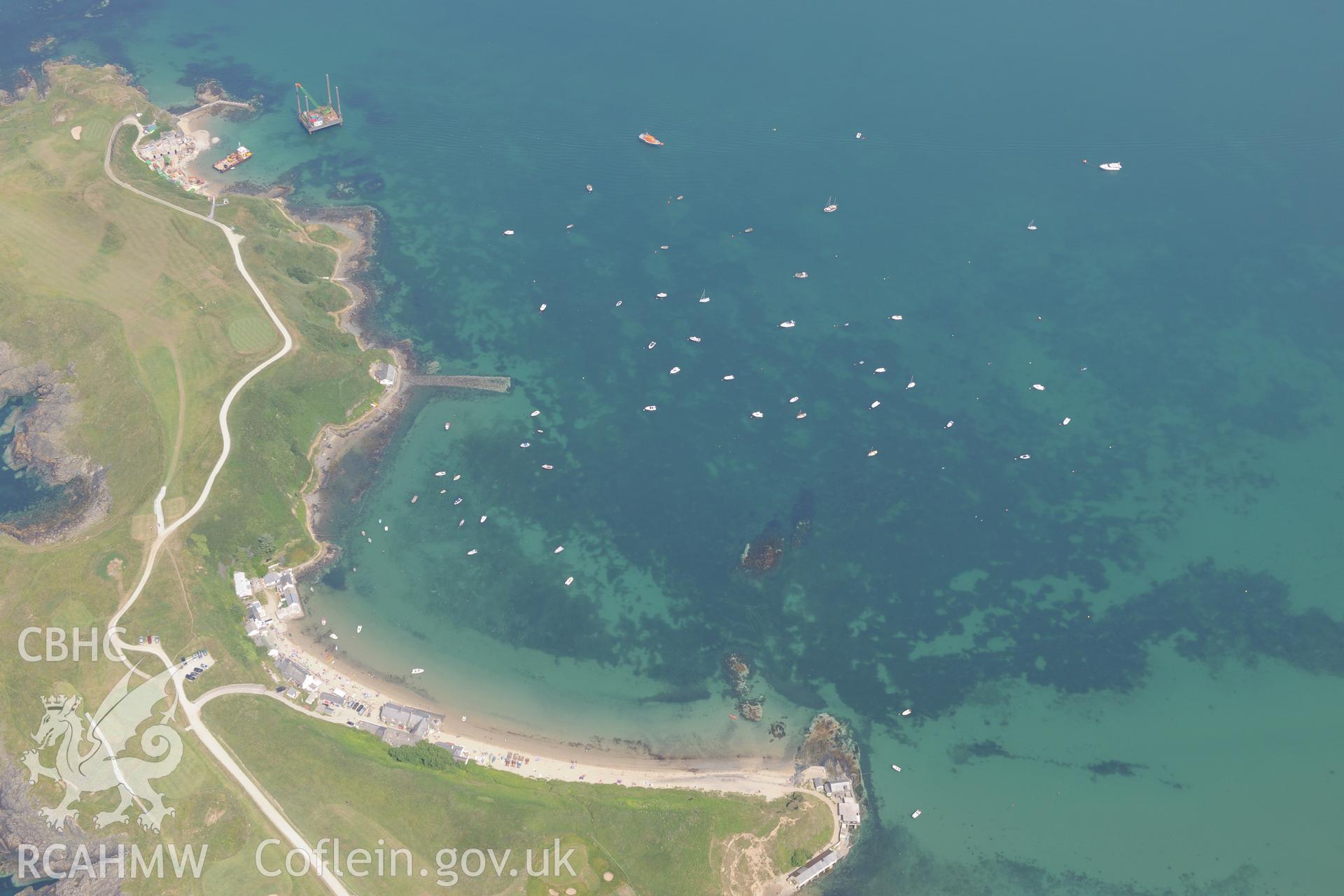 Lifeboat House, Lighthouse, Old Pier, Trwyn Porth Dinllaen Promontory Enclosure and Porth Dinllaen village. Oblique aerial photograph taken during the Royal Commission?s programme of archaeological aerial reconnaissance by Toby Driver on 12th July 2013.