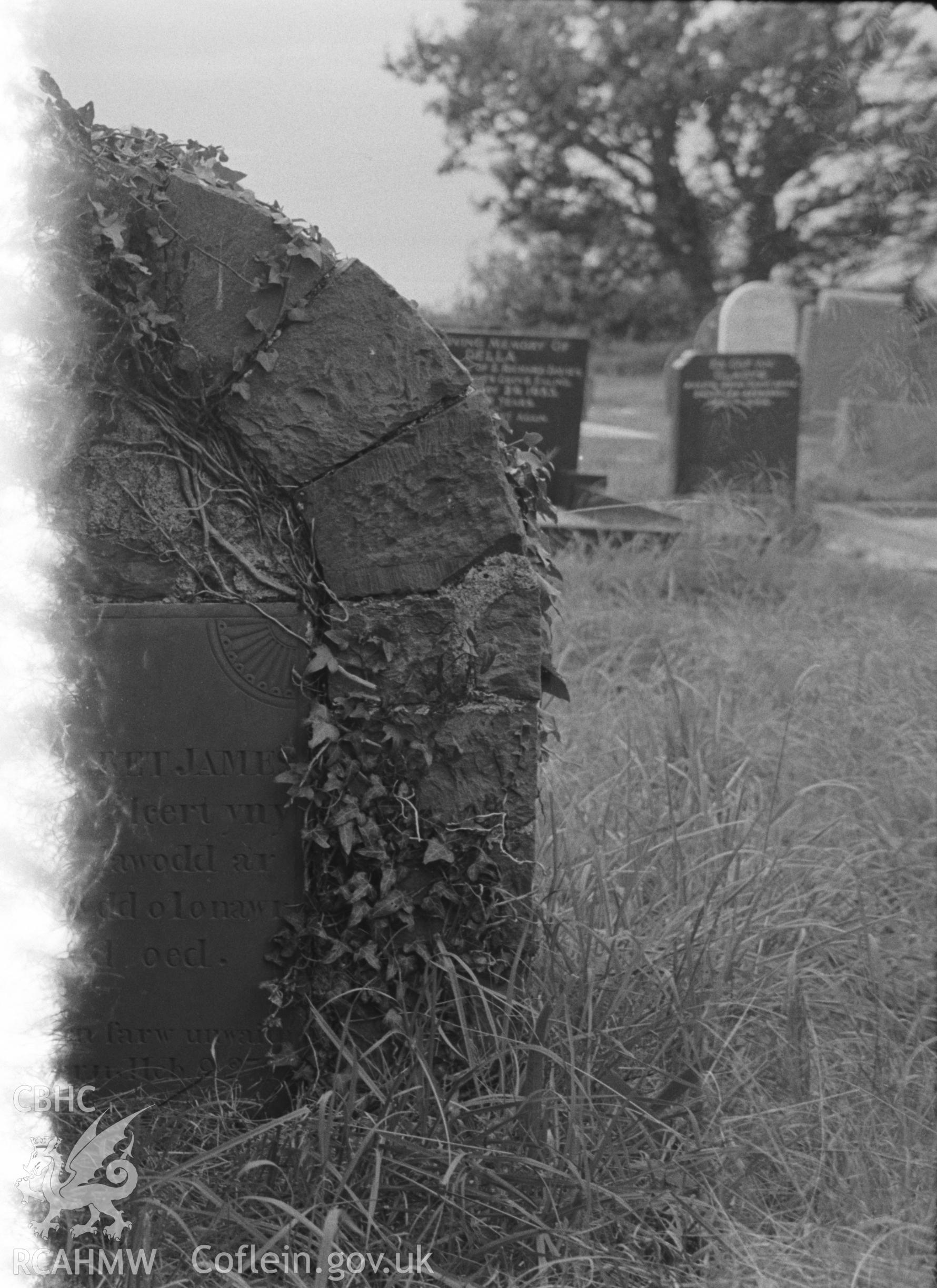 Digital copy of a black and white negative showing gravestone at St. David's Church, Henfynyw, Aberaeron. Photographed by Arthur O. Chater on 5th September 1966 from Grid Reference SN 447 613.