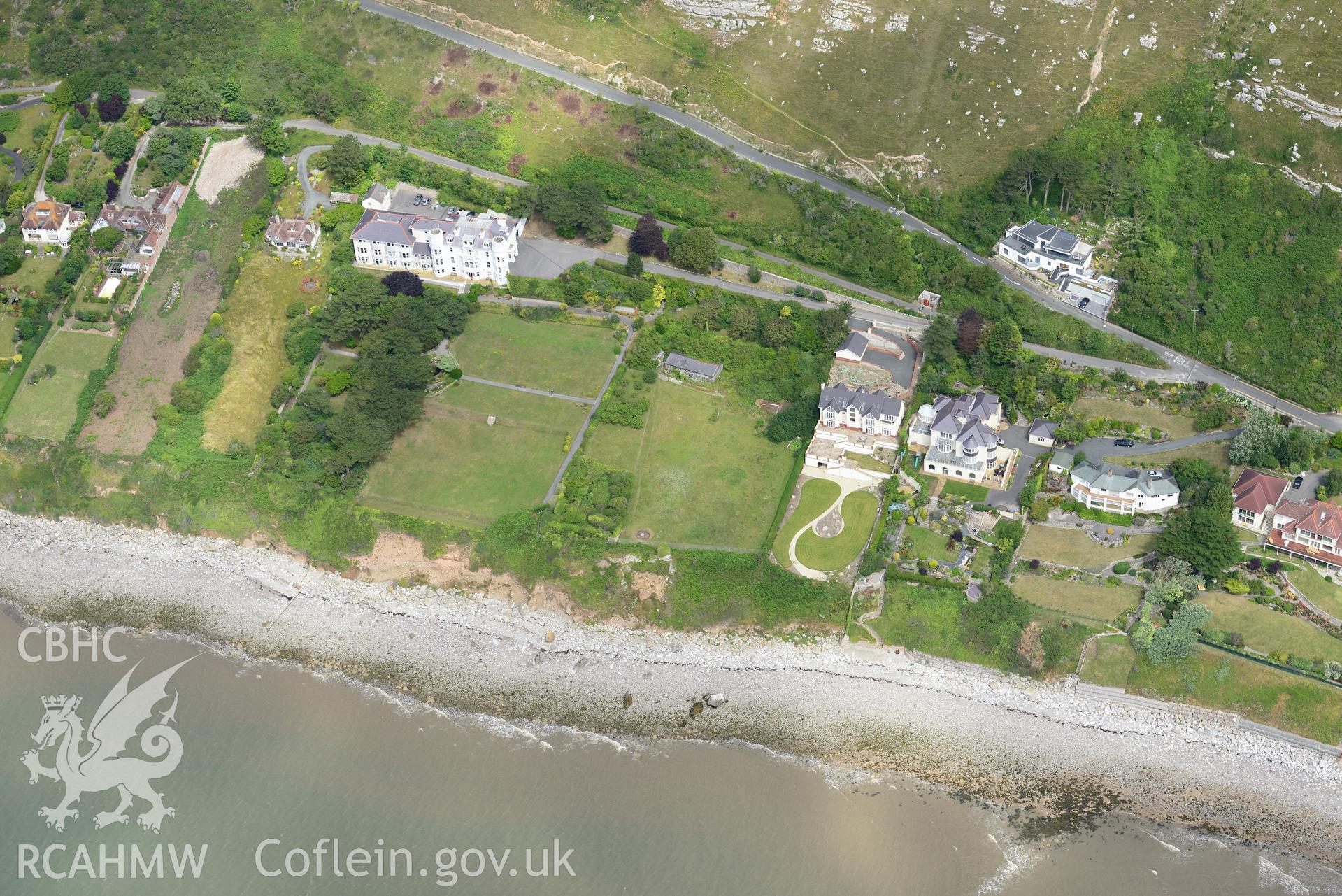 Gogarth Abbey convalescent home or hotel and garden; Gogarth Abbey remains and Gogarth Abbey Lodge. Oblique aerial photograph taken during the Royal Commission's programme of archaeological aerial reconnaissance by Toby Driver on 30th July 2015.