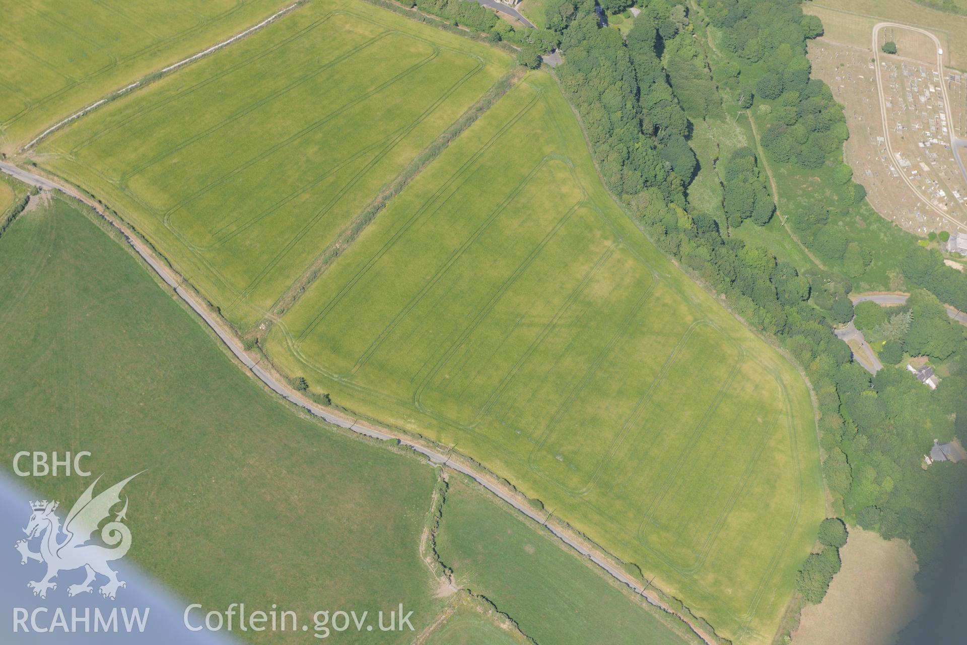 Pont y Penyd Cropmarks and the Vicarage at Penrhiw, St Davids. Oblique aerial photograph taken during the Royal Commission?s programme of archaeological aerial reconnaissance by Toby Driver on 16th July 2013.