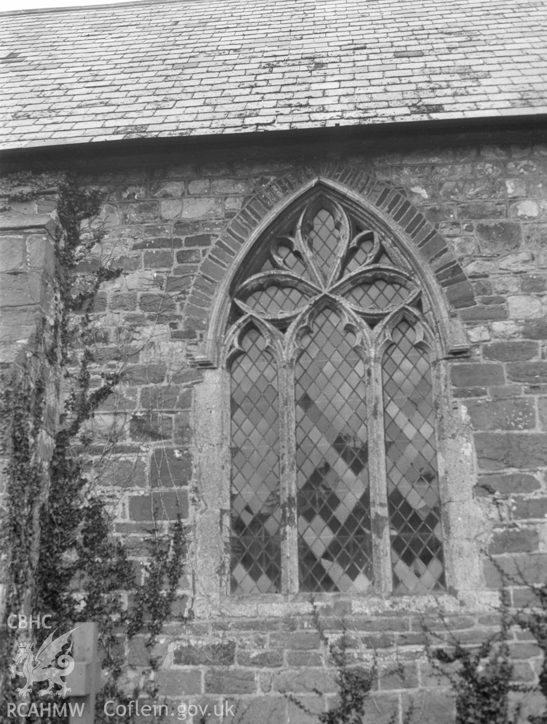 Digital copy of a nitrate negative showing exterior view of chancel window, St Mary's Church (Priory Church), Kidwelly. From the National Building Record Postcard Collection.