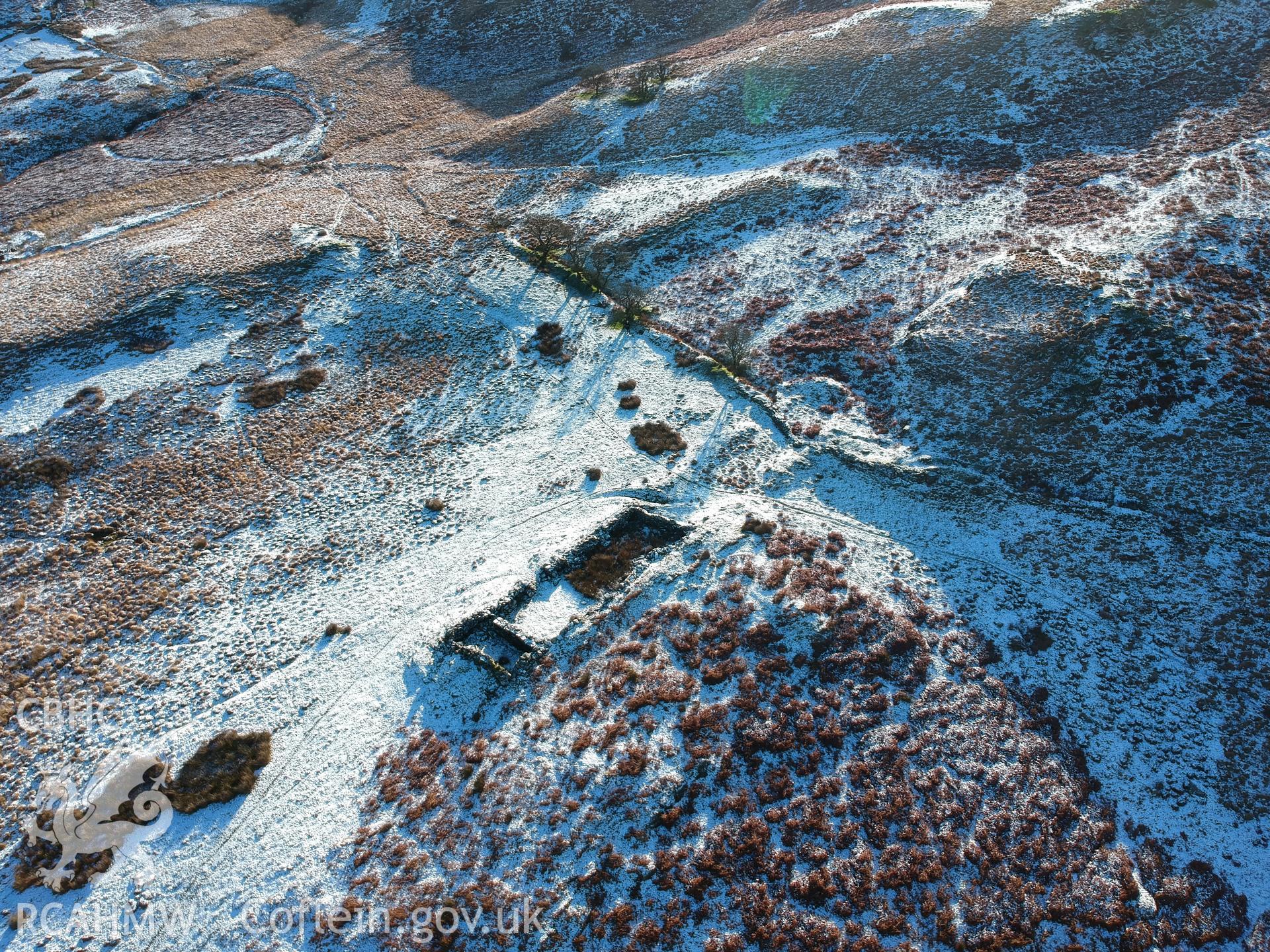 Aerial view showing remains of deserted, dry-stone walled Hafod Eidos rural settlement, Cwm Mwyro. Colour photograph taken by Paul R. Davis on 17th January 2019.