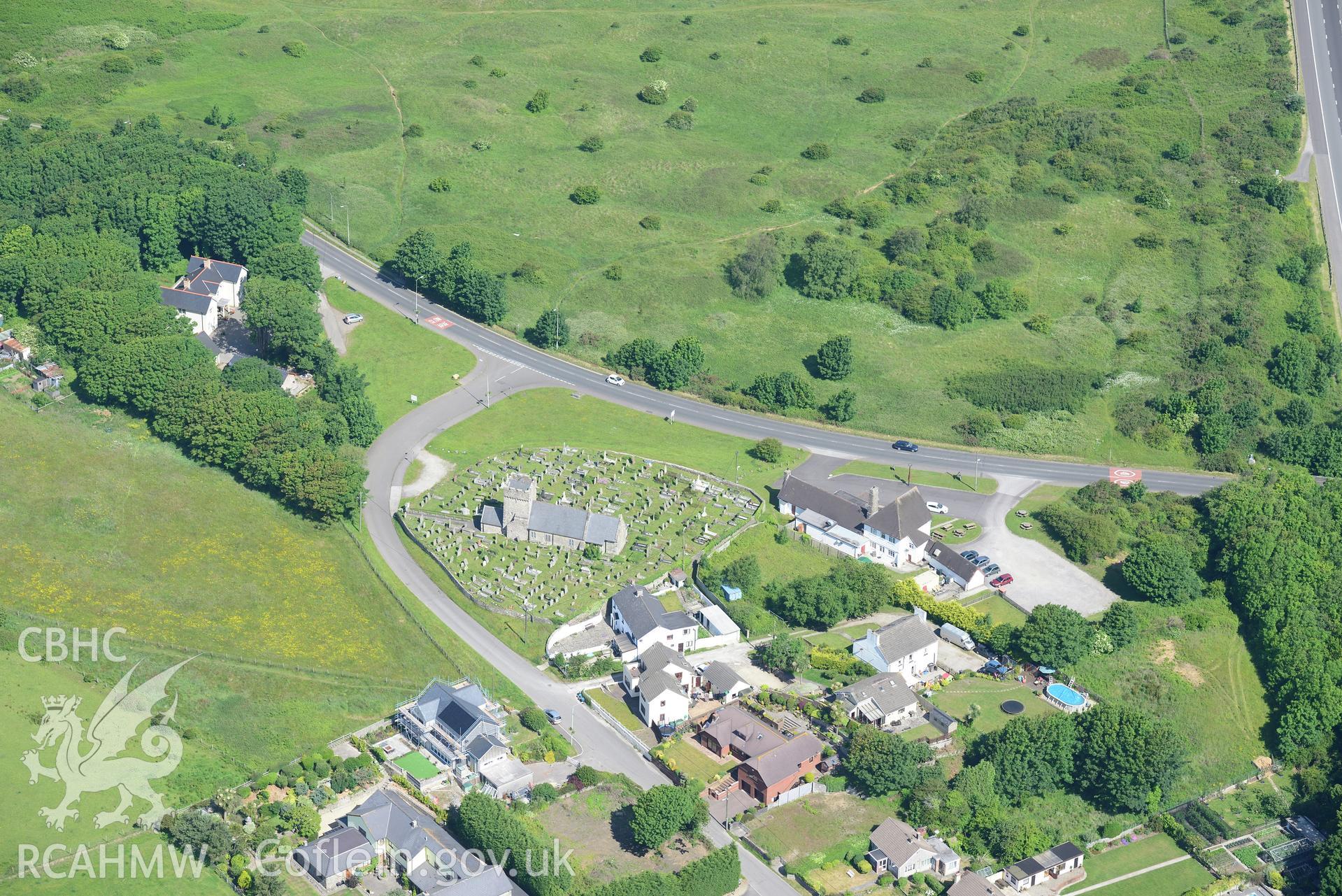 St. Mary Magdalen's Church and The Angel Inn, Mawdlam. Oblique aerial photograph taken during the Royal Commission's programme of archaeological aerial reconnaissance by Toby Driver on 19th June 2015.