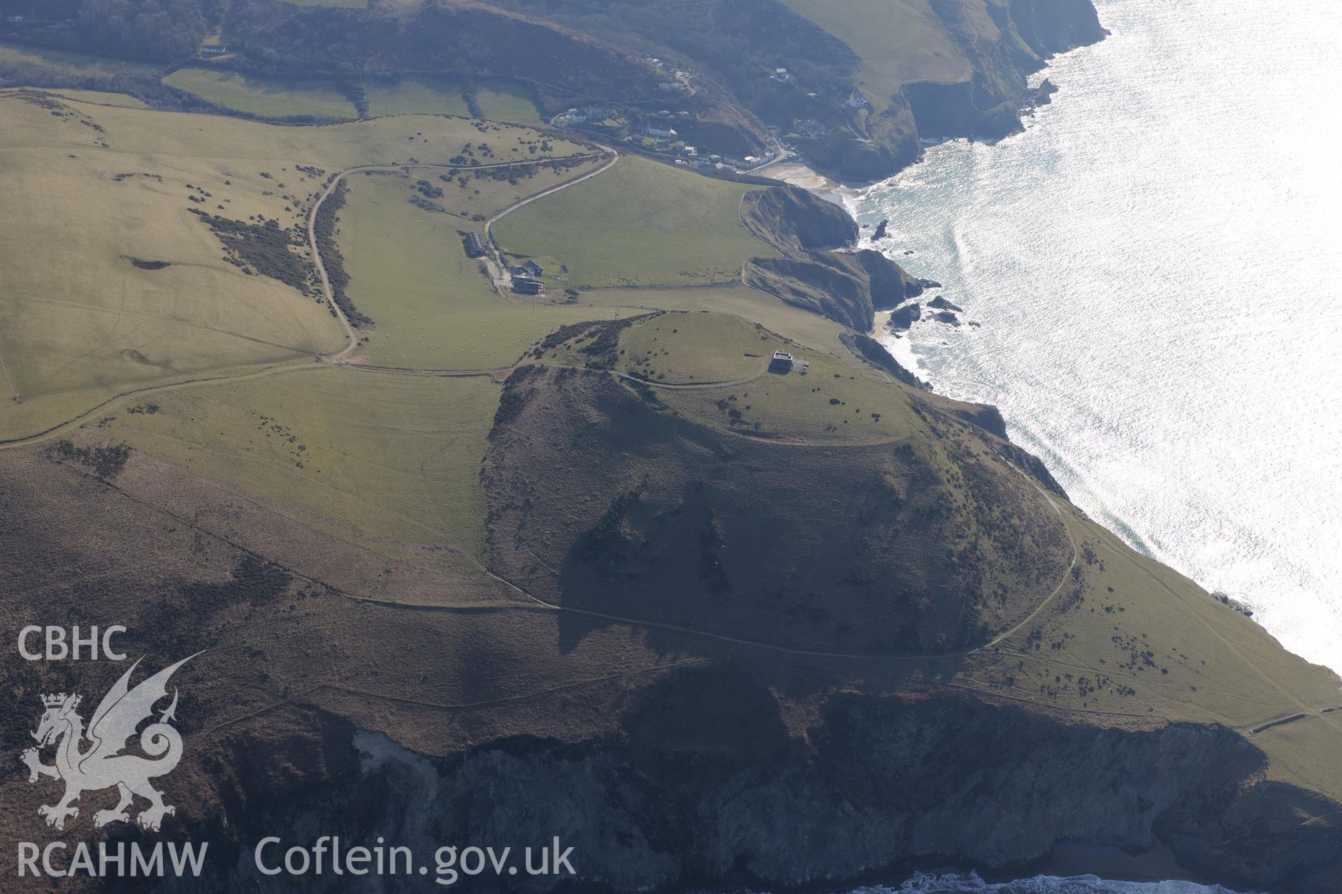 Pen Dinas Lochtyn hillfort, Llangrannog, north east of Cardigan. Oblique aerial photograph taken during the Royal Commission's programme of archaeological aerial reconnaissance by Toby Driver on 2nd April 2013.