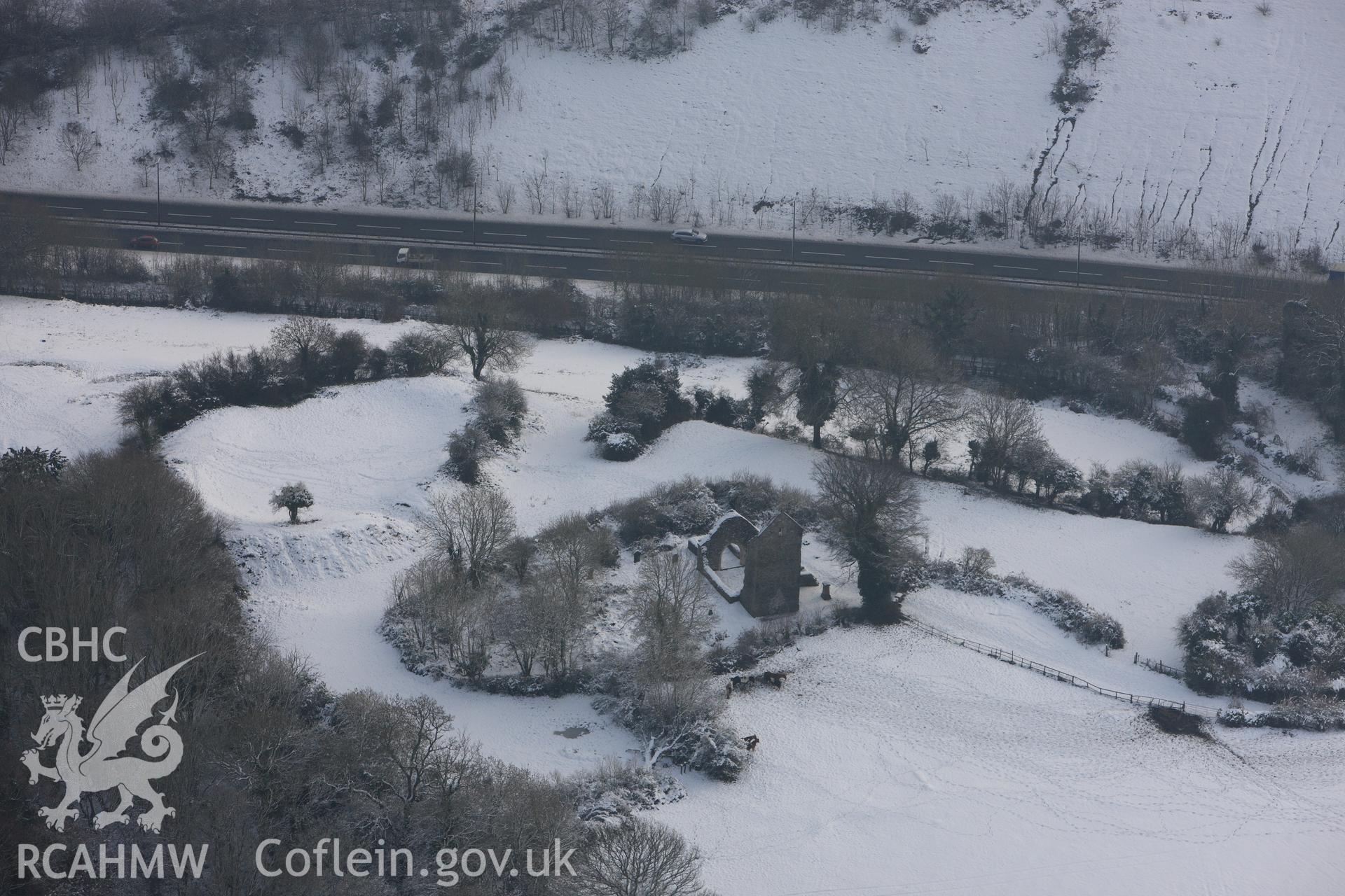 St Mary's church and Caerau Castle ringwork, Caerau, Cardiff. Oblique aerial photograph taken during the Royal Commission?s programme of archaeological aerial reconnaissance by Toby Driver on 24th January 2013.