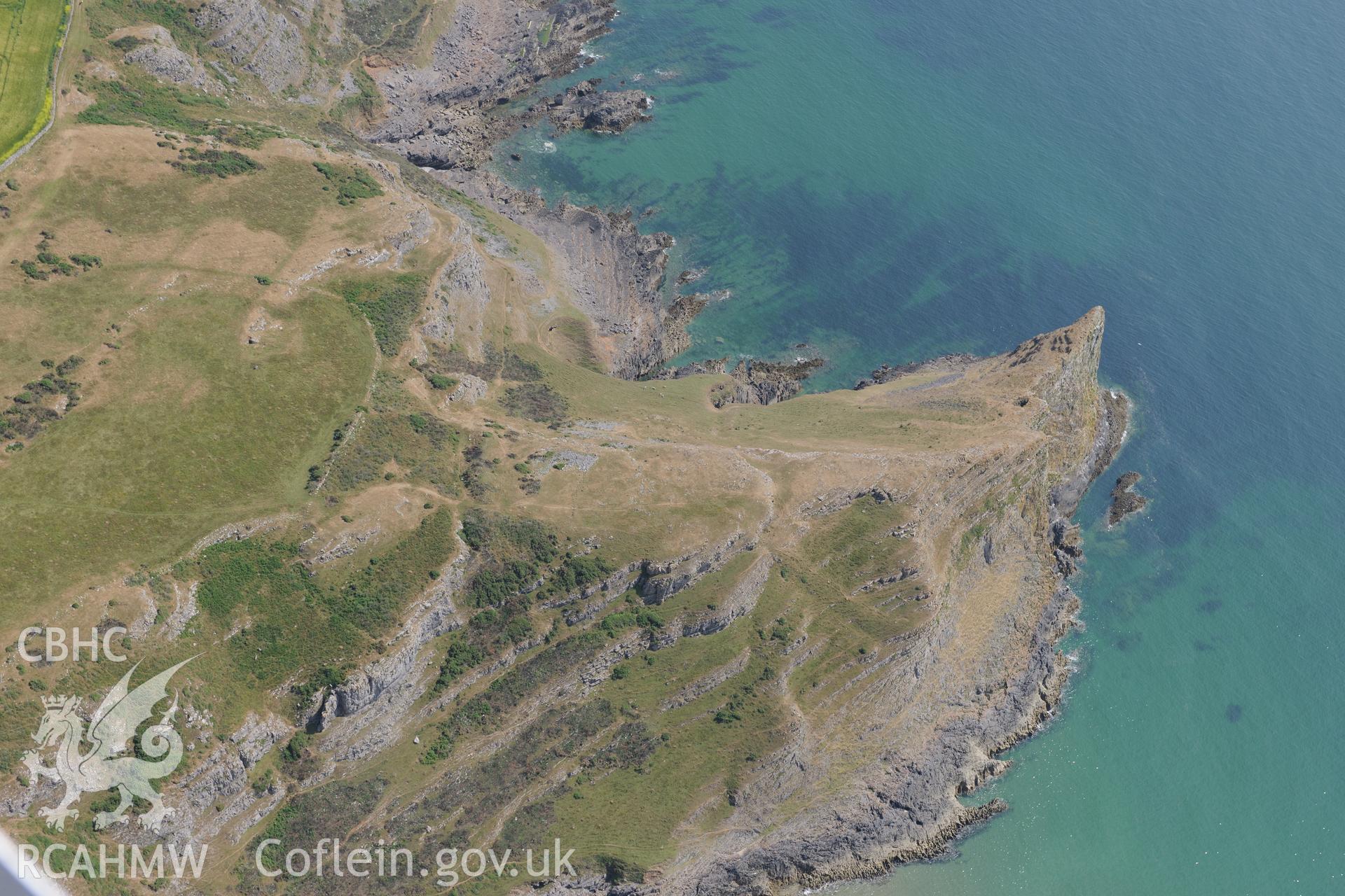 Thurba Camp defended enclosure or promontory fort, on the south western coast of the Gower. Oblique aerial photograph taken during the Royal Commission?s programme of archaeological aerial reconnaissance by Toby Driver on 16th July 2013.