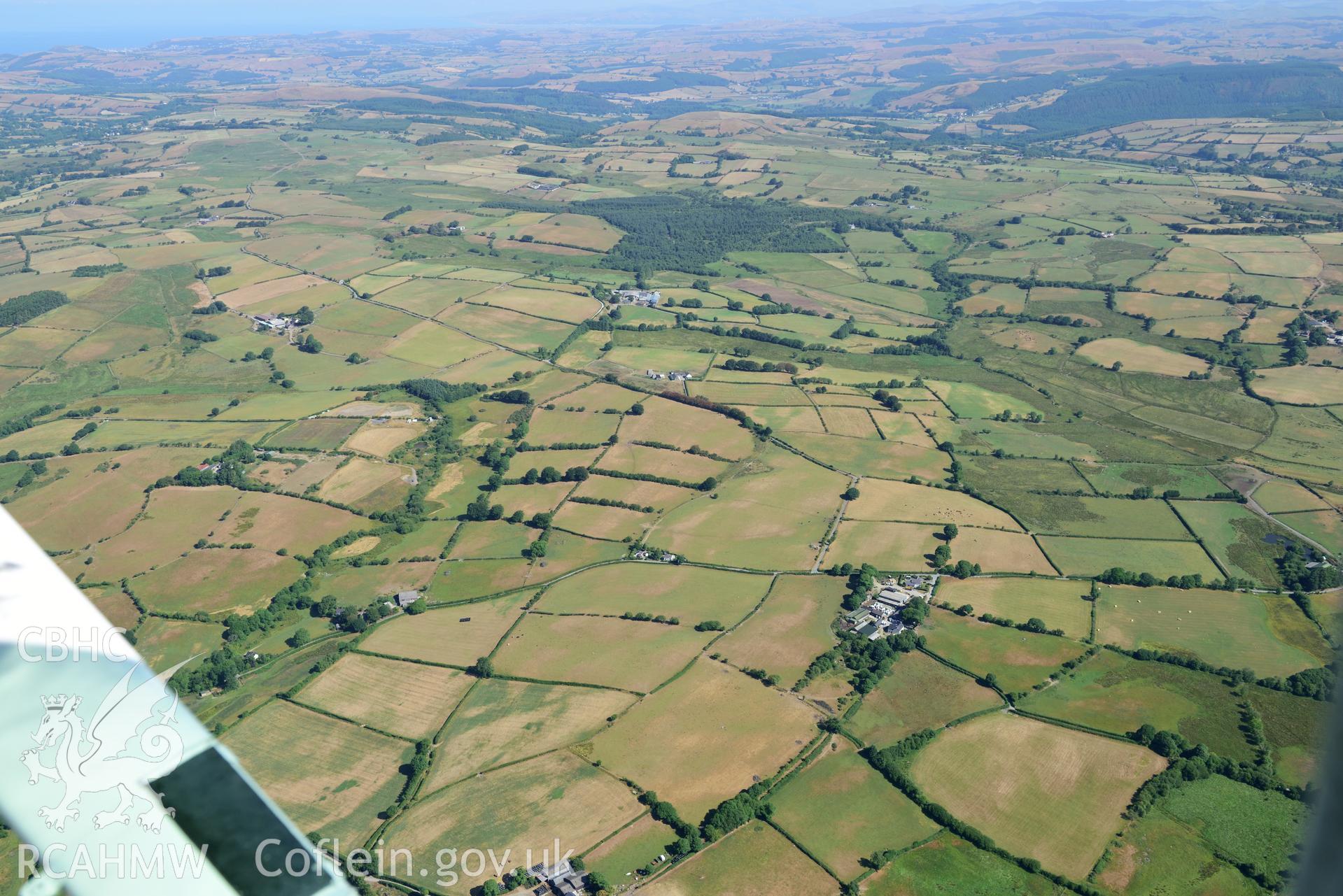 Royal Commission aerial photography of Gwenhafdre Uchaf, a landscape view from the south with parching, taken on 19th July 2018 during the 2018 drought.