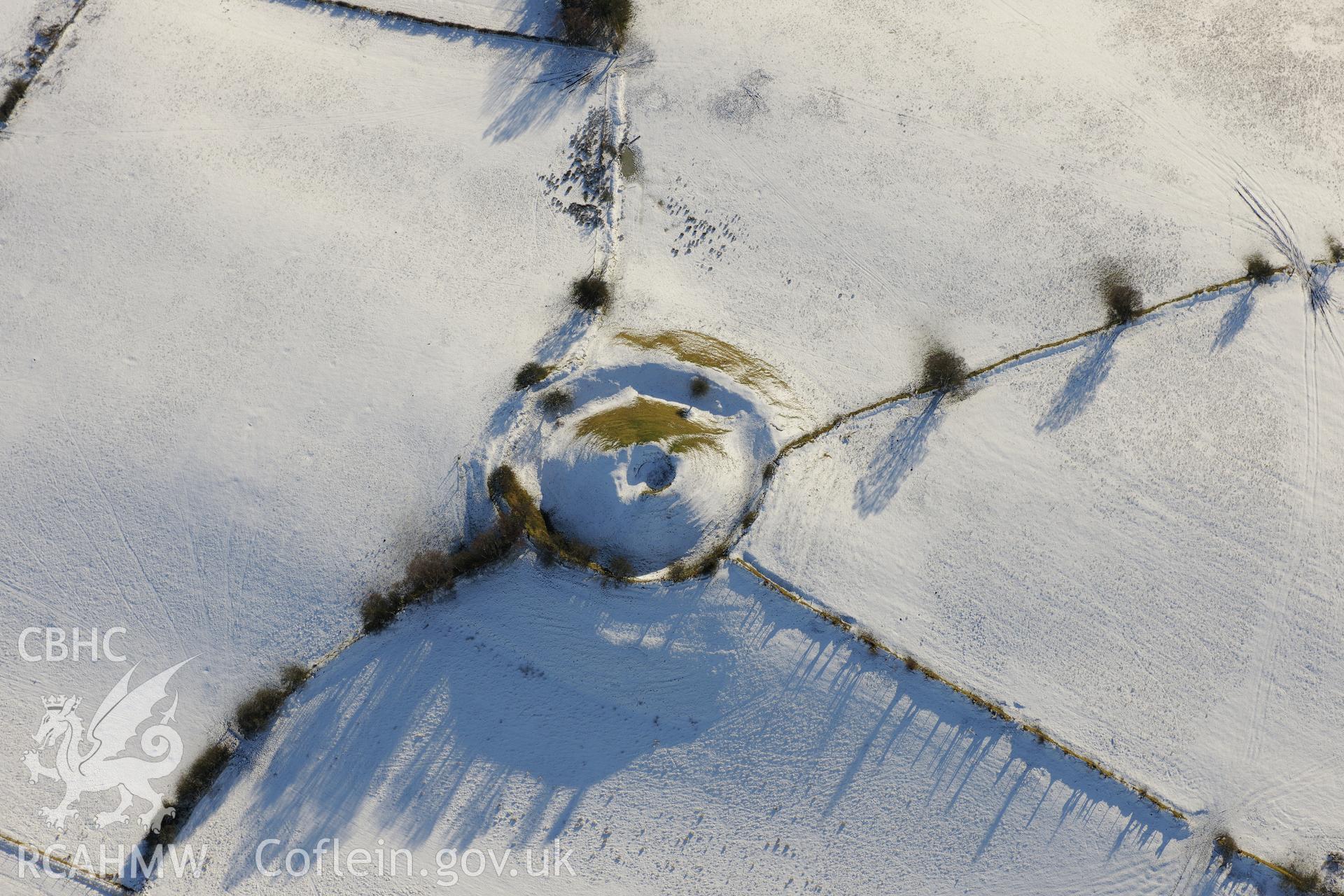 Cwm Camlais castle mound and motte, south west of Brecon. Oblique aerial photograph taken during the Royal Commission?s programme of archaeological aerial reconnaissance by Toby Driver on 15th January 2013.