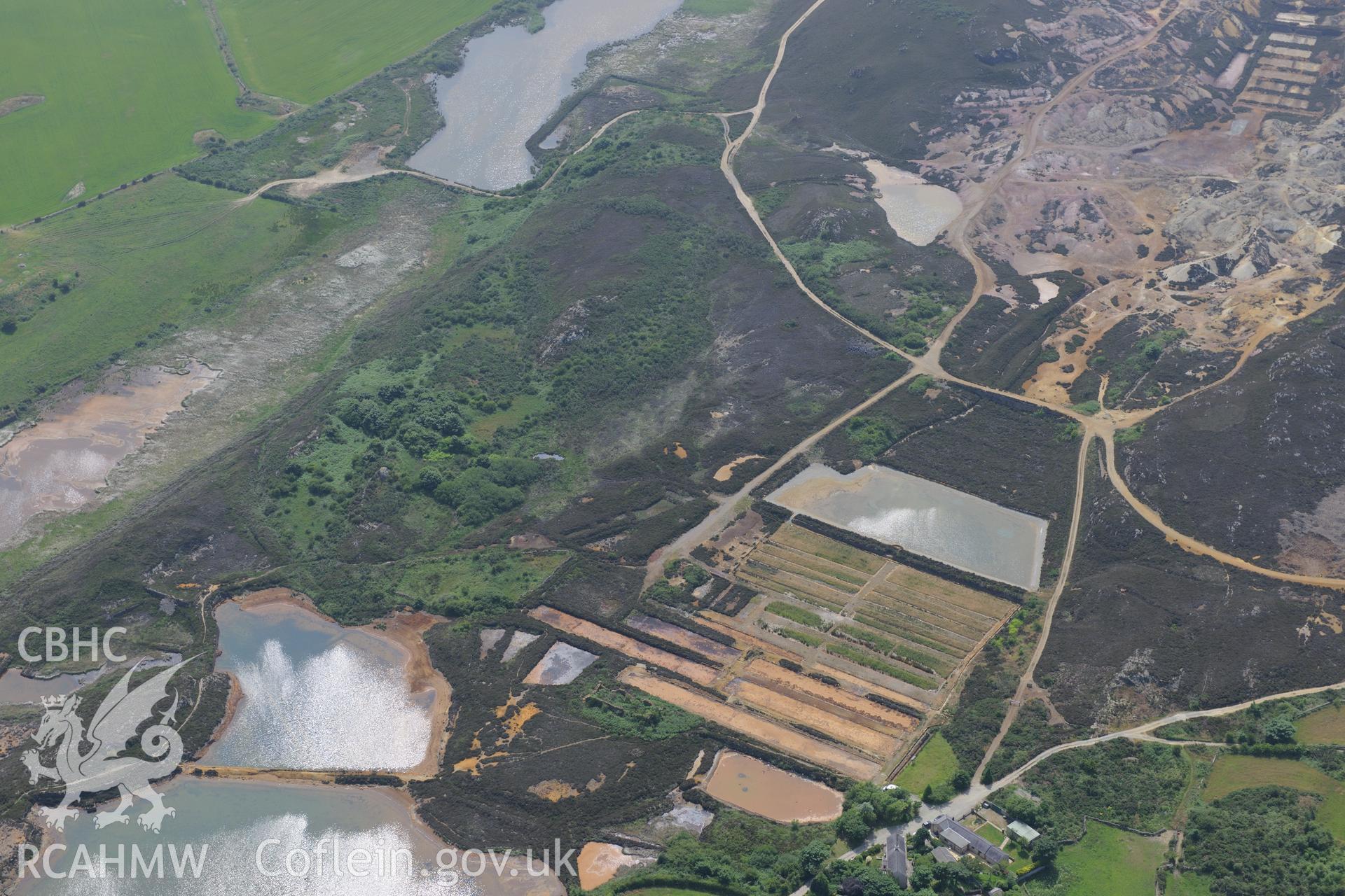 Parys Mountain copper mines, Amlwch, Anglesey. Oblique aerial photograph taken during the Royal Commission?s programme of archaeological aerial reconnaissance by Toby Driver on 12th July 2013.