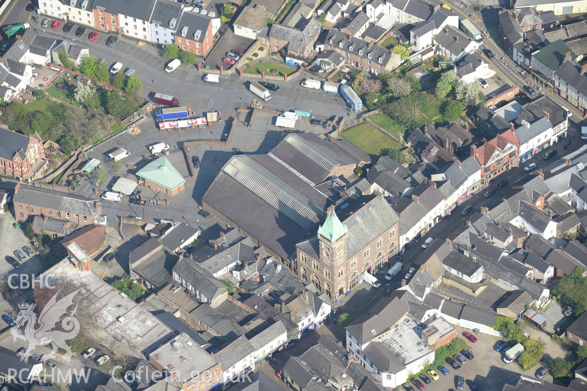 Abergavenny including the Town and Market Halls; the Kings Head Inn and the Brewery Yard. Oblique aerial photograph taken during the Royal Commission's programme of archaeological aerial reconnaissance by Toby Driver on 21st April 2015.