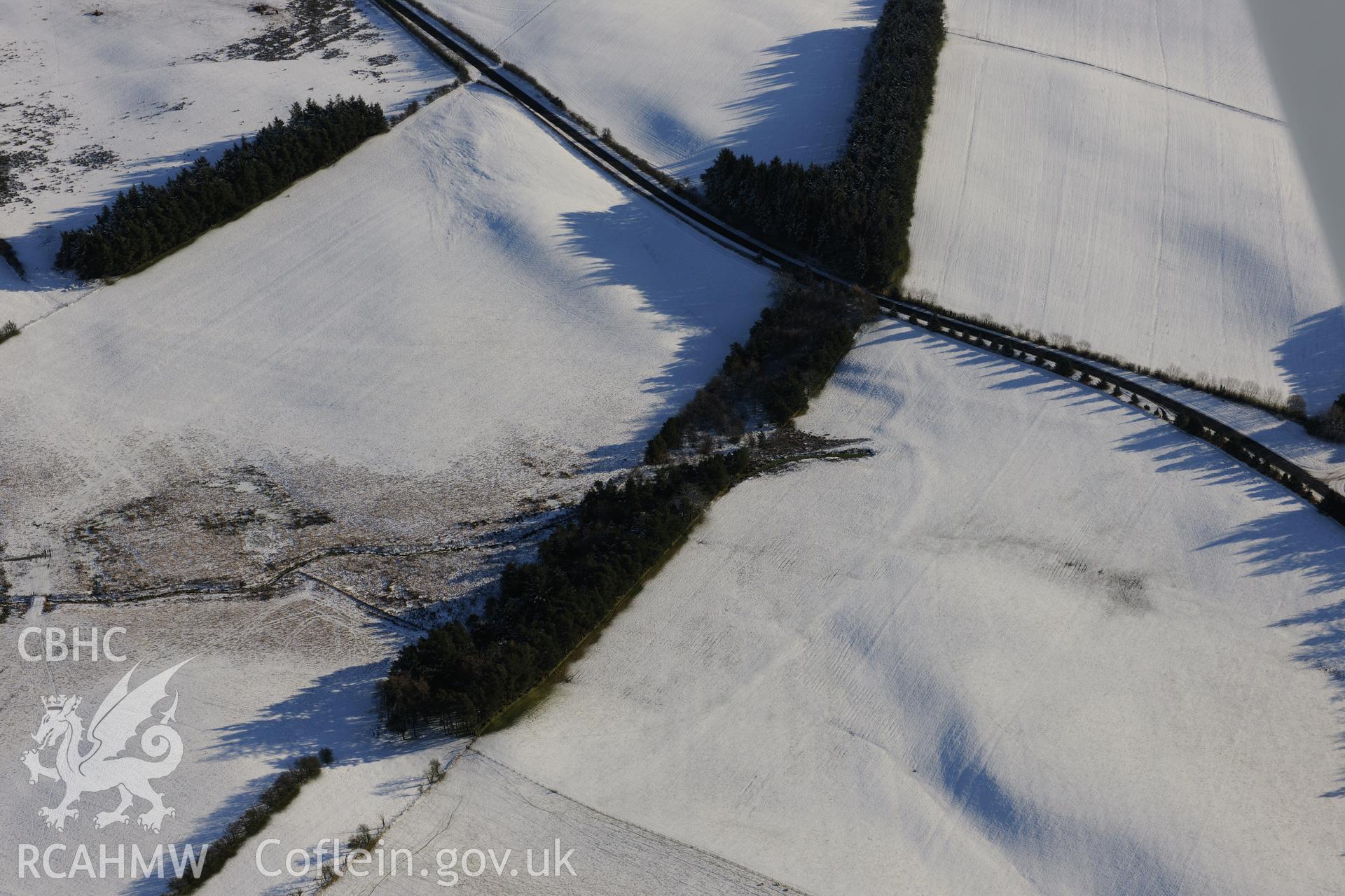 The south western section of the Roman road on Mynydd Illtyd, south west of Brecon. Oblique aerial photograph taken during the Royal Commission?s programme of archaeological aerial reconnaissance by Toby Driver on 15th January 2013.