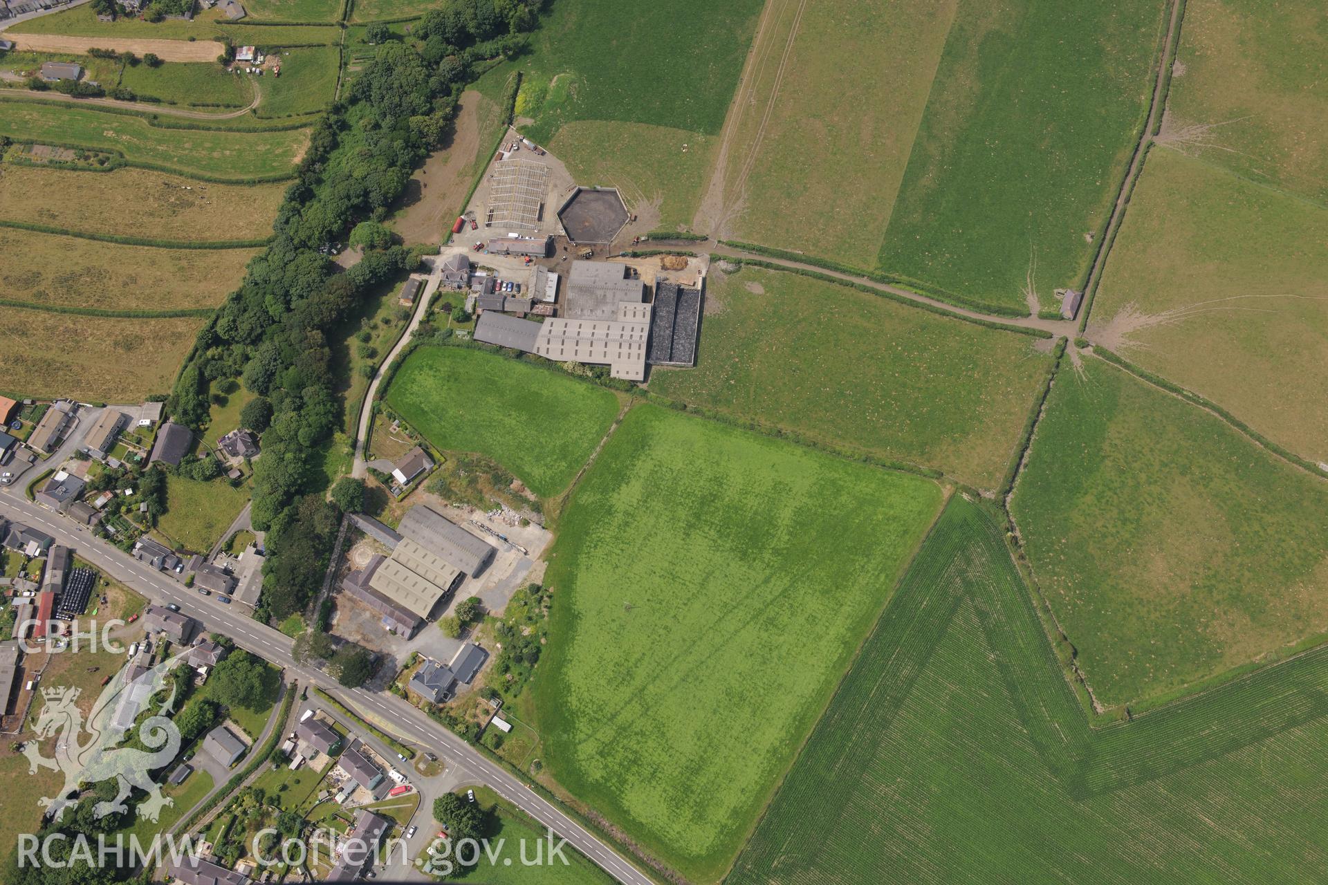 Double ditches at Penlon Farm, Llanon, Aberystwyth. Oblique aerial photograph taken during the Royal Commission?s programme of archaeological aerial reconnaissance by Toby Driver on 12th July 2013.