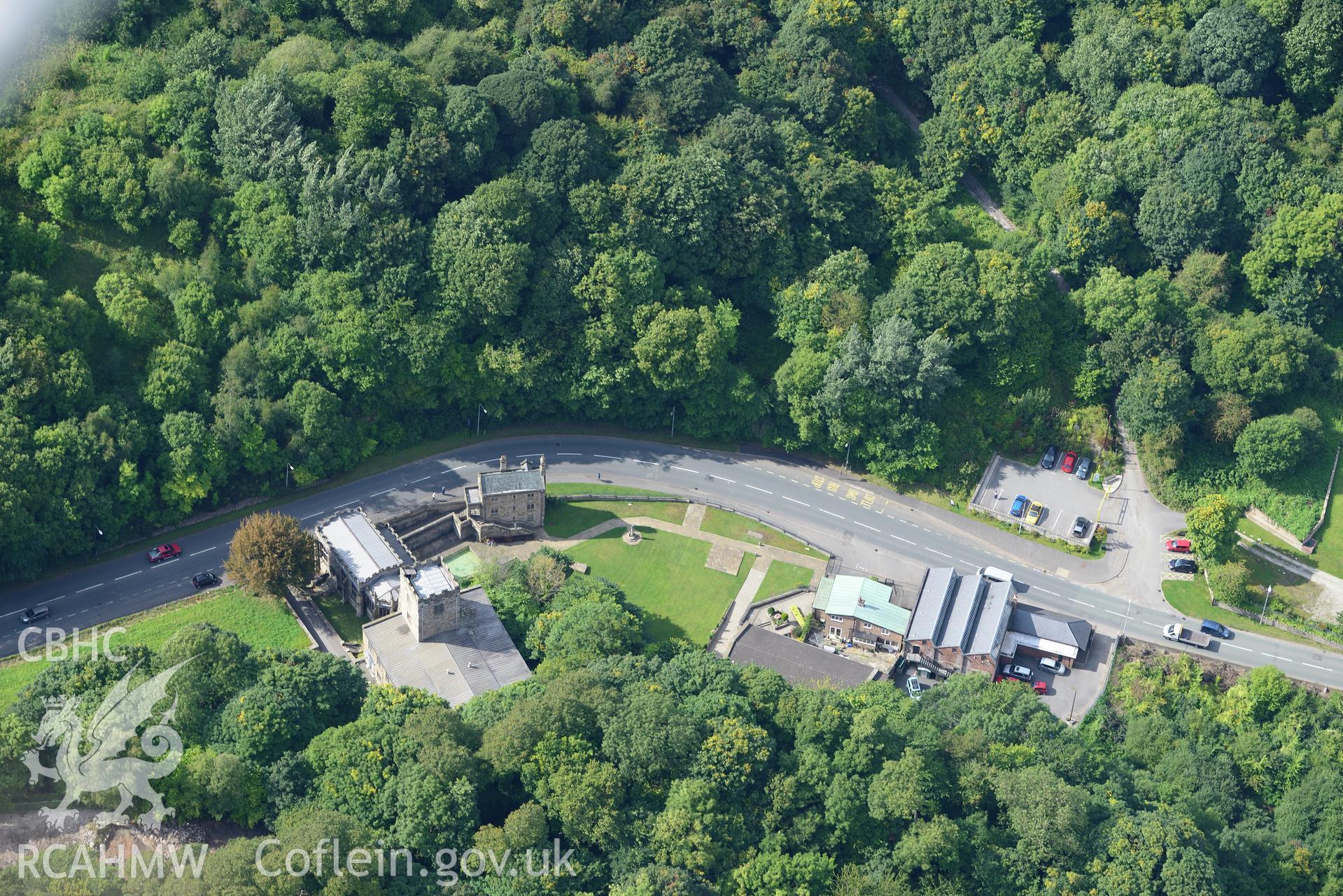 St. Winifride's well and well chapel, and St. James the Apostle's Church, Holywell. Oblique aerial photograph taken during the Royal Commission's programme of archaeological aerial reconnaissance by Toby Driver on 11th September 2015.