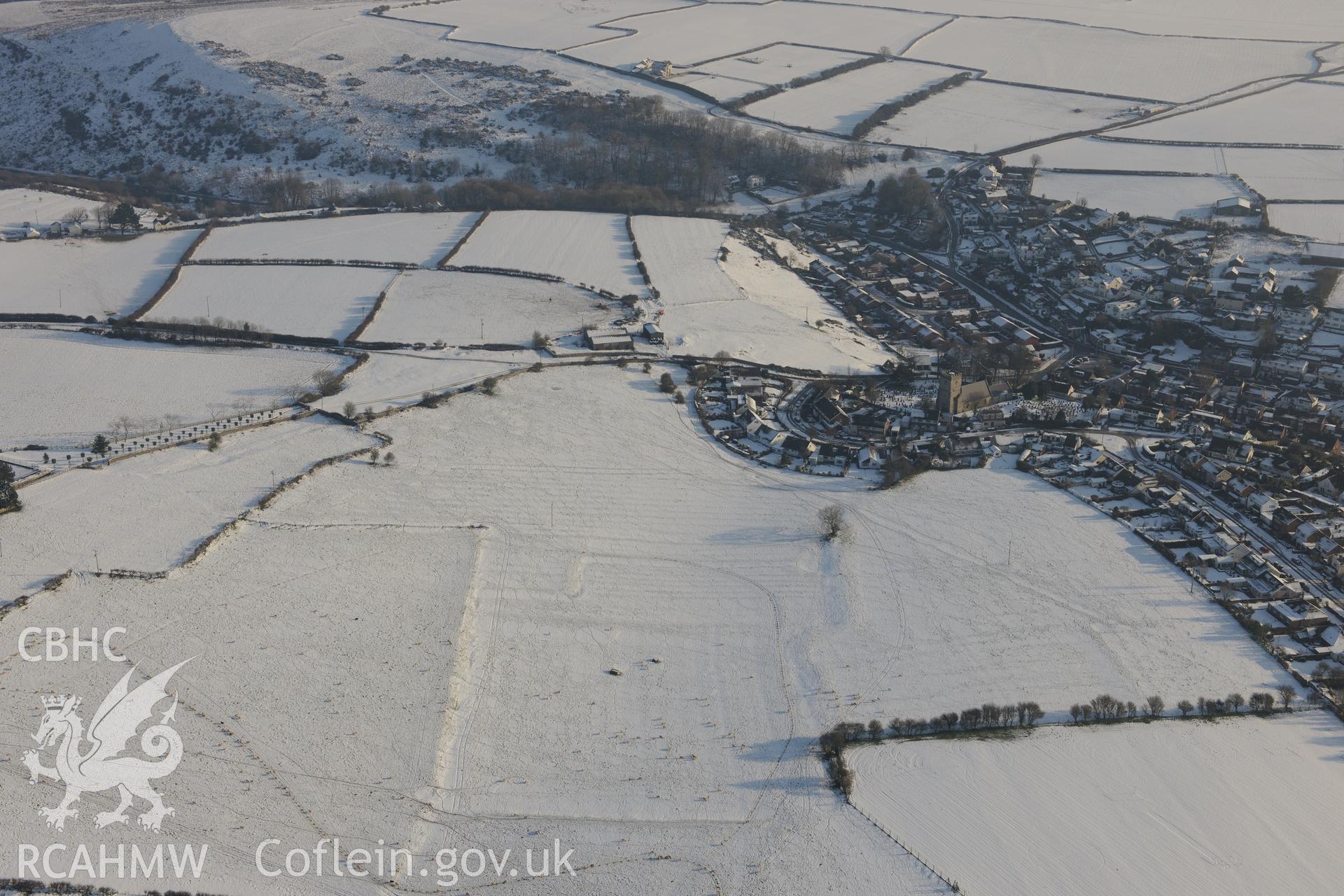 Earthworks west of St. Brides and St. Bride's Church, St. Bride's, south of Bridgend. Oblique aerial photograph taken during the Royal Commission?s programme of archaeological aerial reconnaissance by Toby Driver on 24th January 2013.