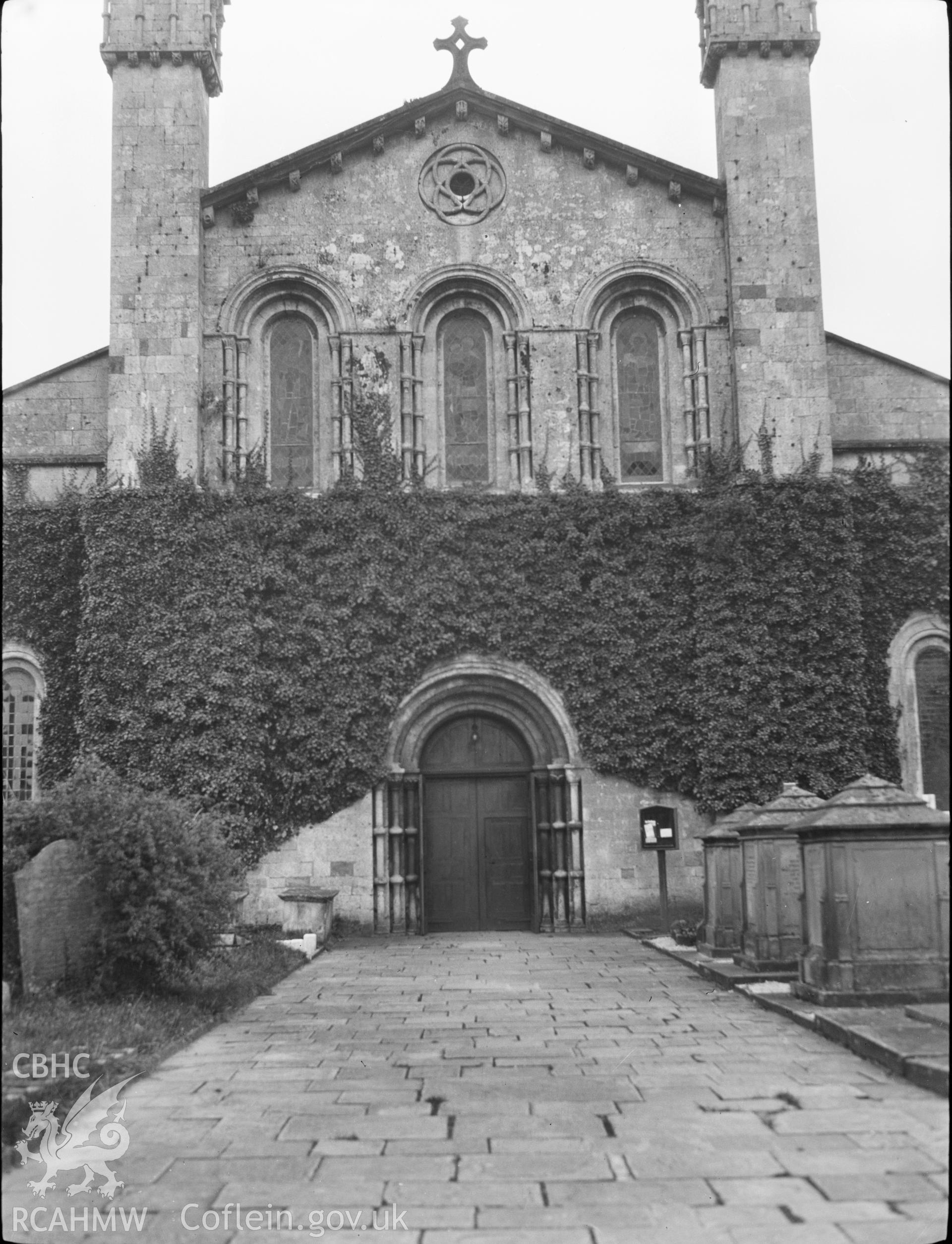 Digital copy of a nitrate negative showing exterior view of St Mary's Church, Margam, showing Norman doorway. From the National Building Record Postcard Collection.