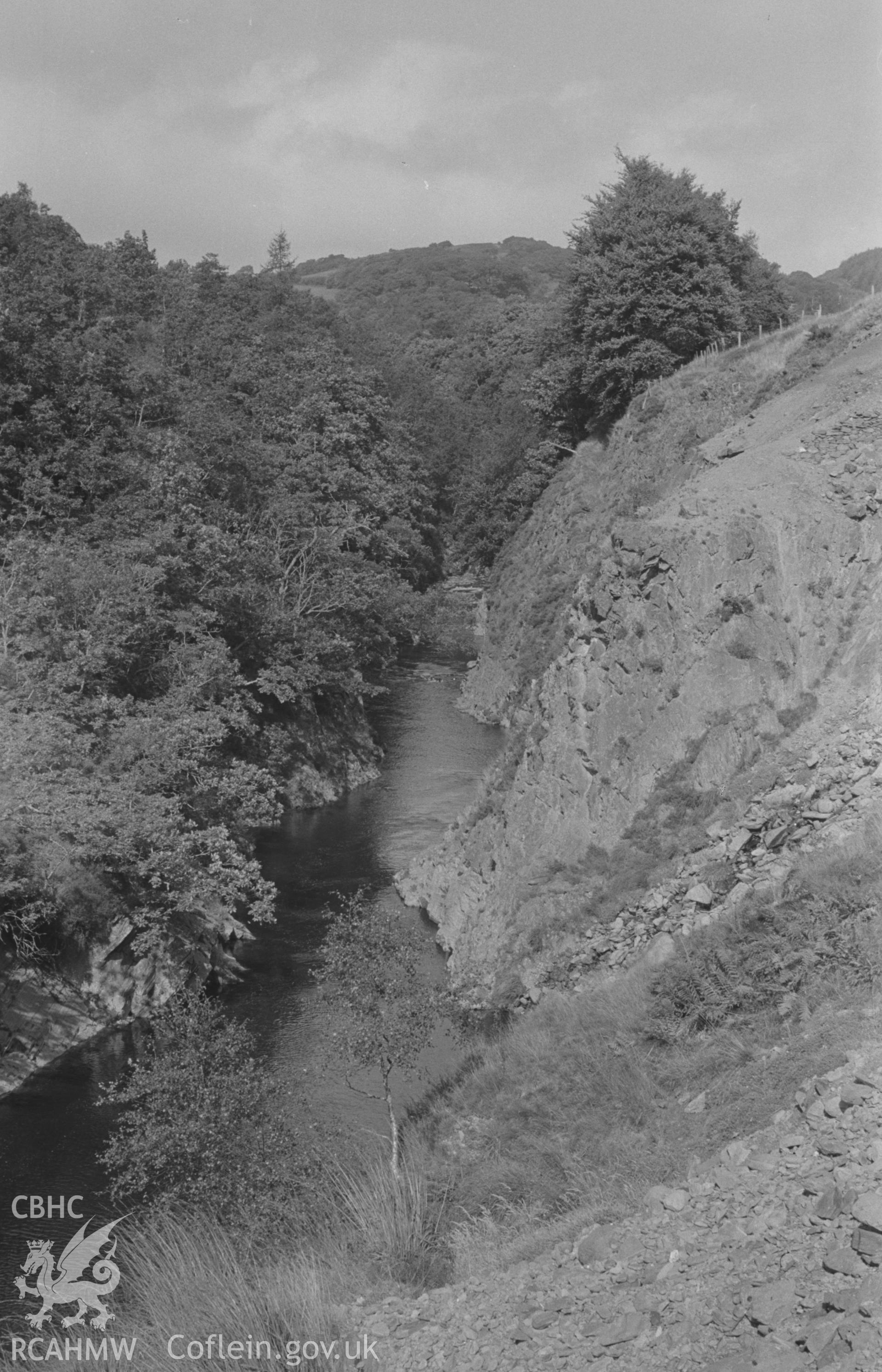 Digital copy of black and white negative showing view looking up the Ystwyth gorge by the lead-mine workings at the south end of Pont-Rhyd-y-Groes. Photographed by Arthur O. Chater in September 1966 looking north north east from Grid Reference SN 737 723.