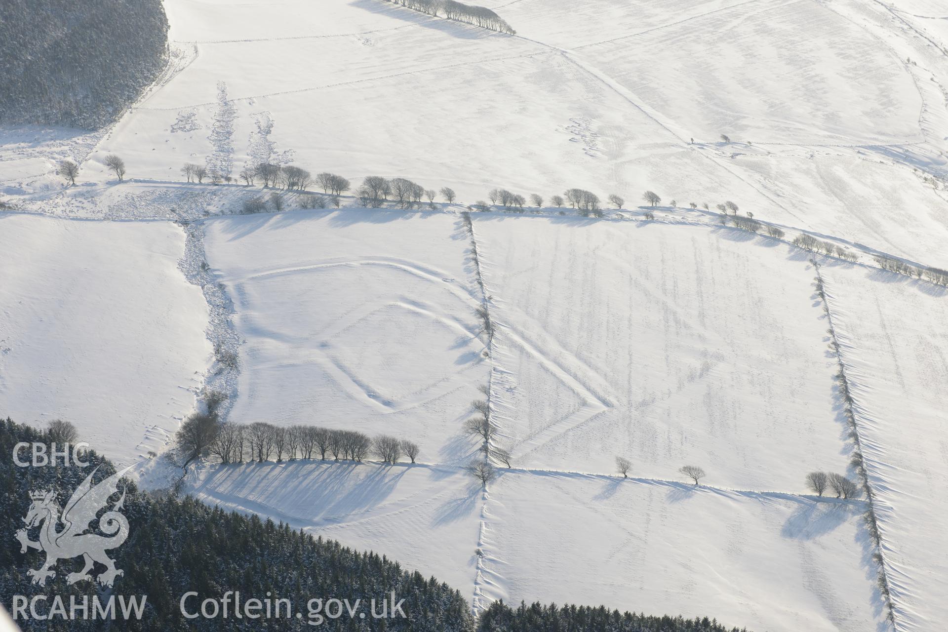 Moel Ton-Mawr hillfort and field system. Oblique aerial photograph taken during the Royal Commission?s programme of archaeological aerial reconnaissance by Toby Driver on 24th January 2013.