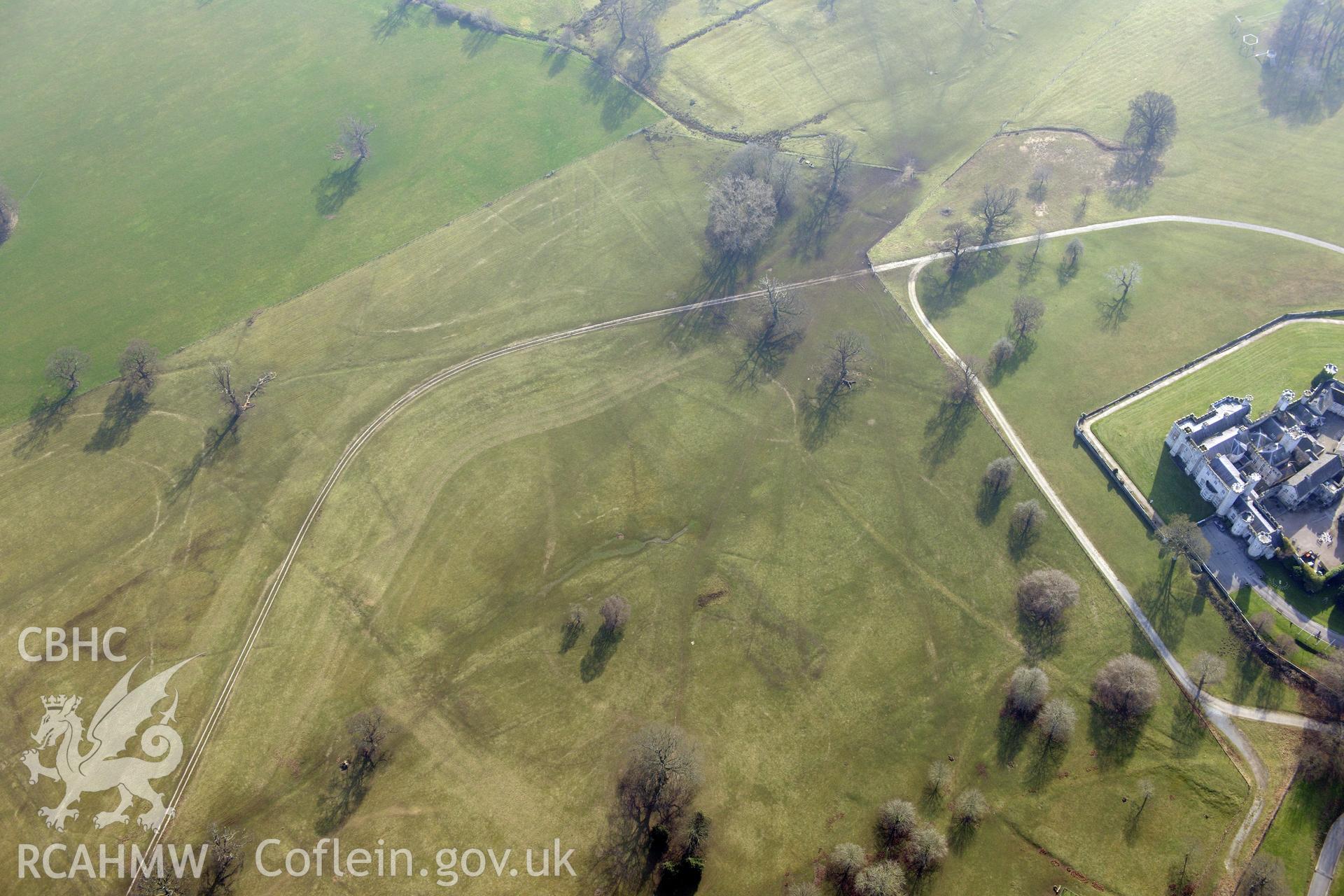 Bodelwyddan Castle, west of St. Asaph. Oblique aerial photograph taken during the Royal Commission?s programme of archaeological aerial reconnaissance by Toby Driver on 28th February 2013.