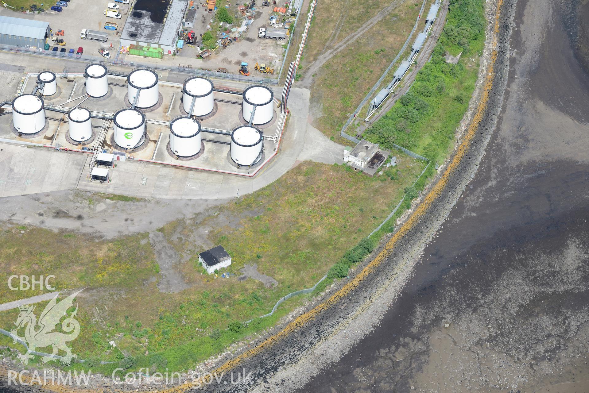 Oil Terminal and Gun Emplacement at Queen Alexandra Dock, Bute Town, Cardiff. Oblique aerial photograph taken during the Royal Commission's programme of archaeological aerial reconnaissance by Toby Driver on 29th June 2015.