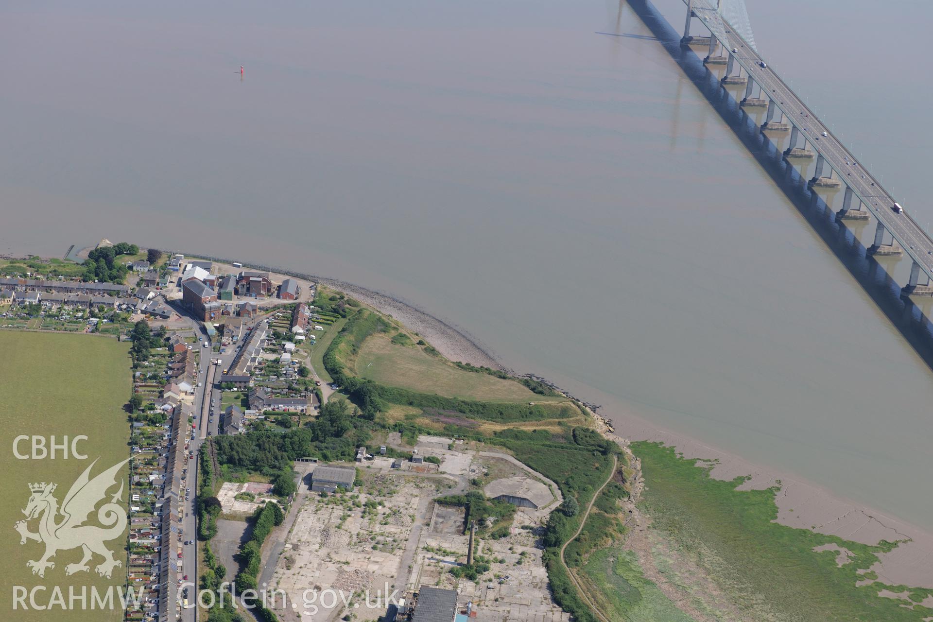 The destroyed Meadow Vaelon House, Sudbrook Fort and Sudbrook medieval village, Portskewett, with the Second Severn crossing for the M4 beyond. Oblique aerial photograph taken during the Royal Commission's programme of archaeological aerial reconnaissance by Toby Driver on 1st August 2013.