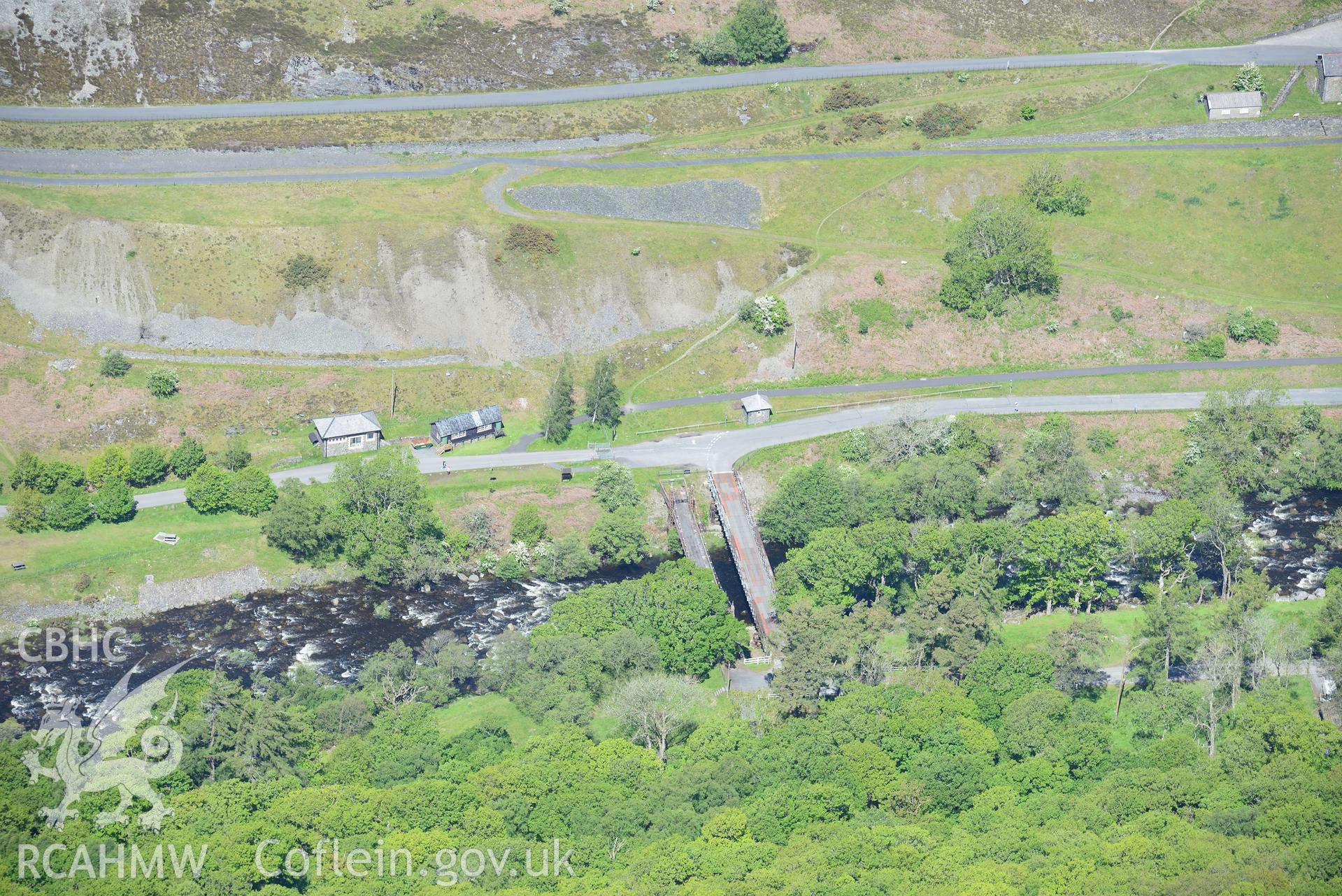 Elan Village outbuildings and suspension bridge. Oblique aerial photograph taken during the Royal Commission's programme of archaeological aerial reconnaissance by Toby Driver on 3rd June 2015.