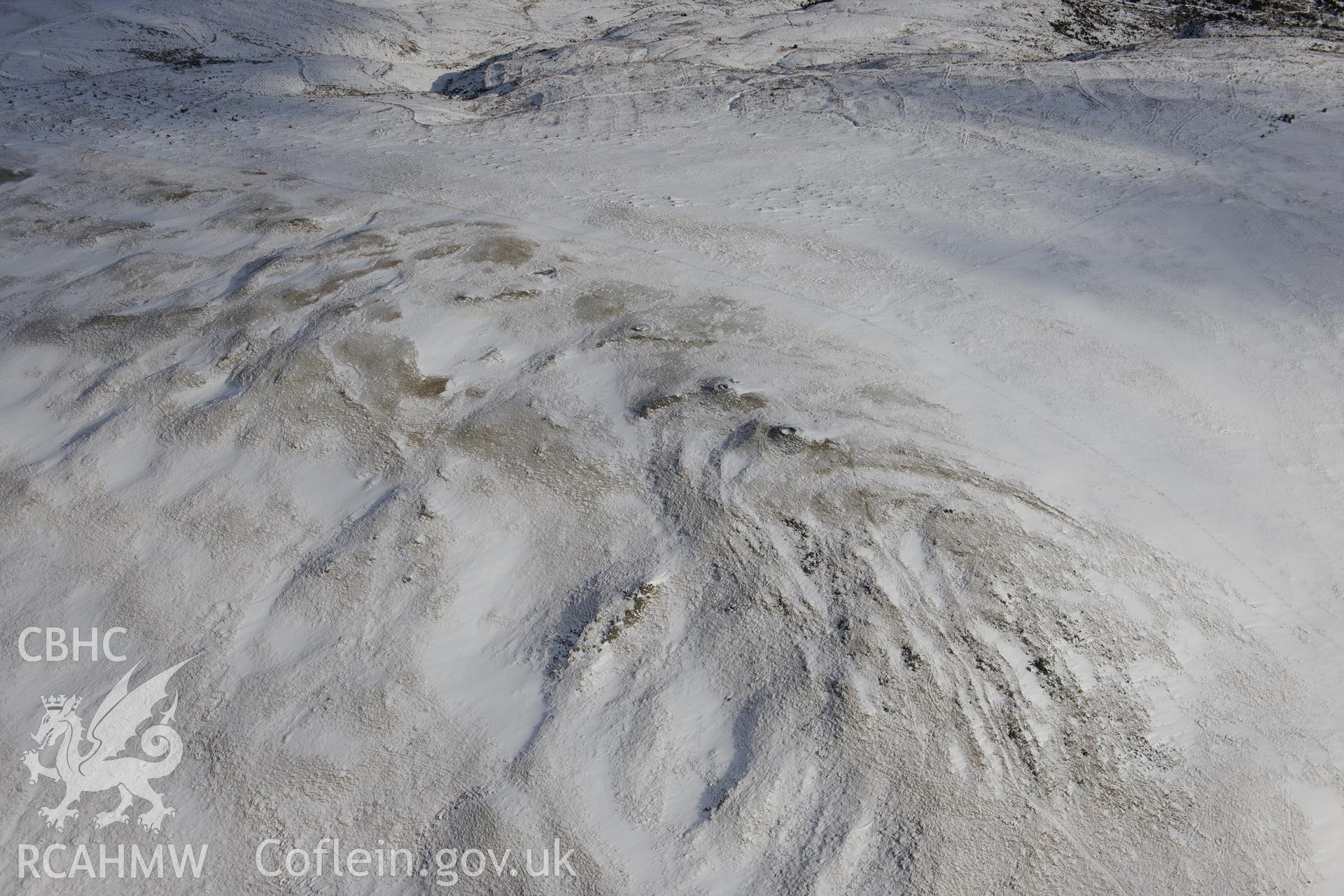 Cairn cemetery at Pen Pumlumon Arwystli, north west of Llangurig. Oblique aerial photograph taken during the Royal Commission's programme of archaeological aerial reconnaissance by Toby Driver on 4th February 2015.