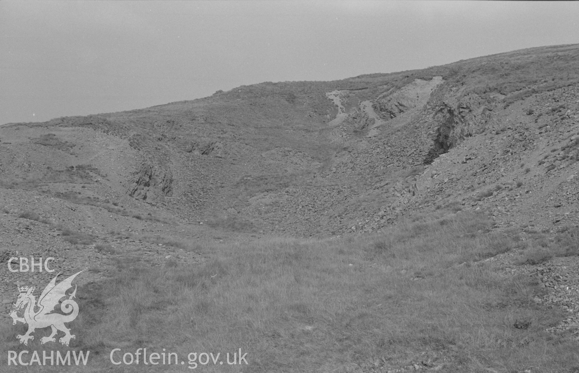 Digital copy of a black and white negative showing the old opencast workings at the top of Esgair Mwyn Mine, Ystrad Fflur (chiefly worked 1767-1788). Photographed by Arthur O. Chater in August 1966 looking north east from Grid Reference SN 756 691.