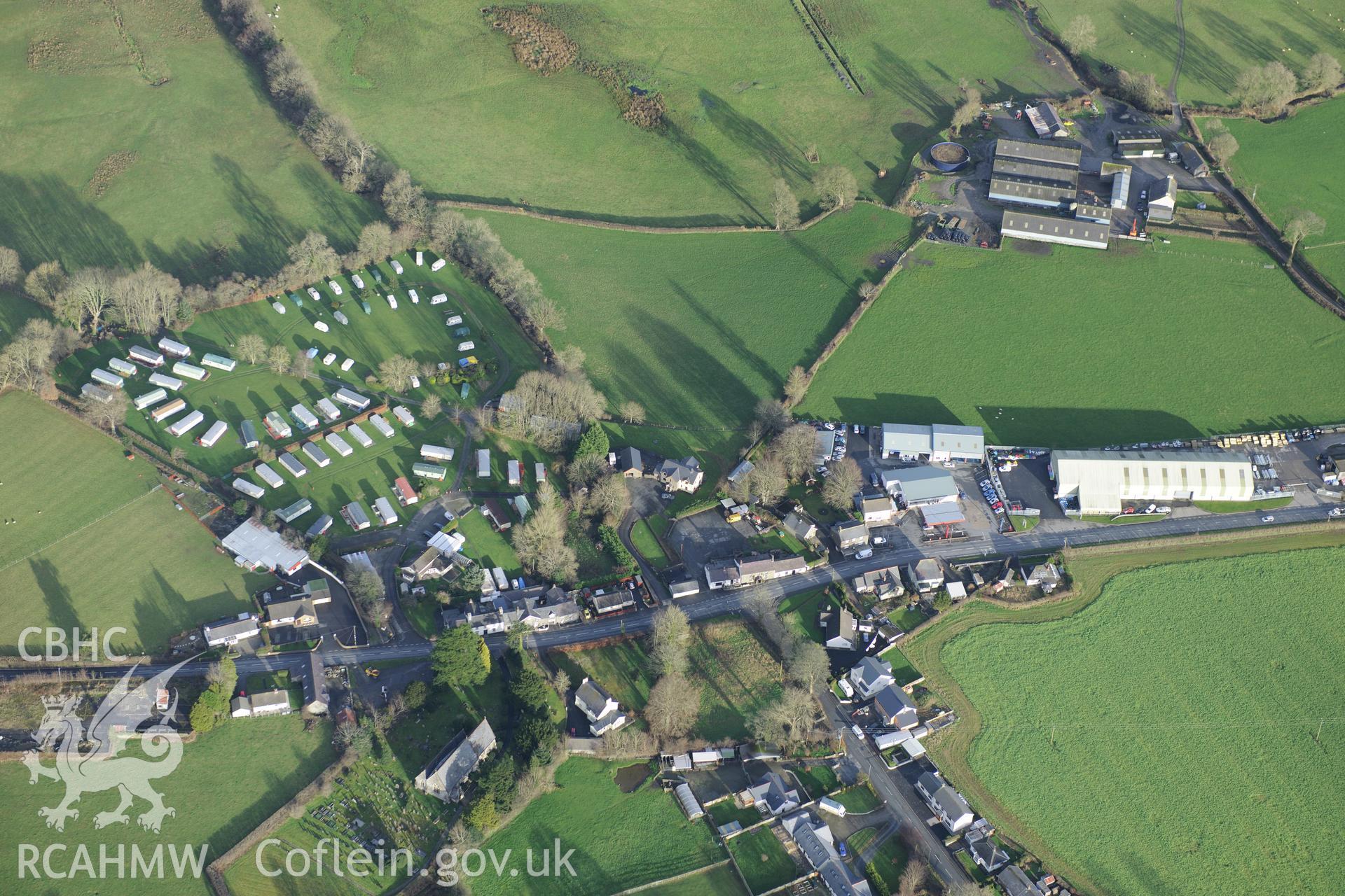 Ystrad Aeron village including St. Michael's Church. Oblique aerial photograph taken during the Royal Commission's programme of archaeological aerial reconnaissance by Toby Driver on 6th January 2015.