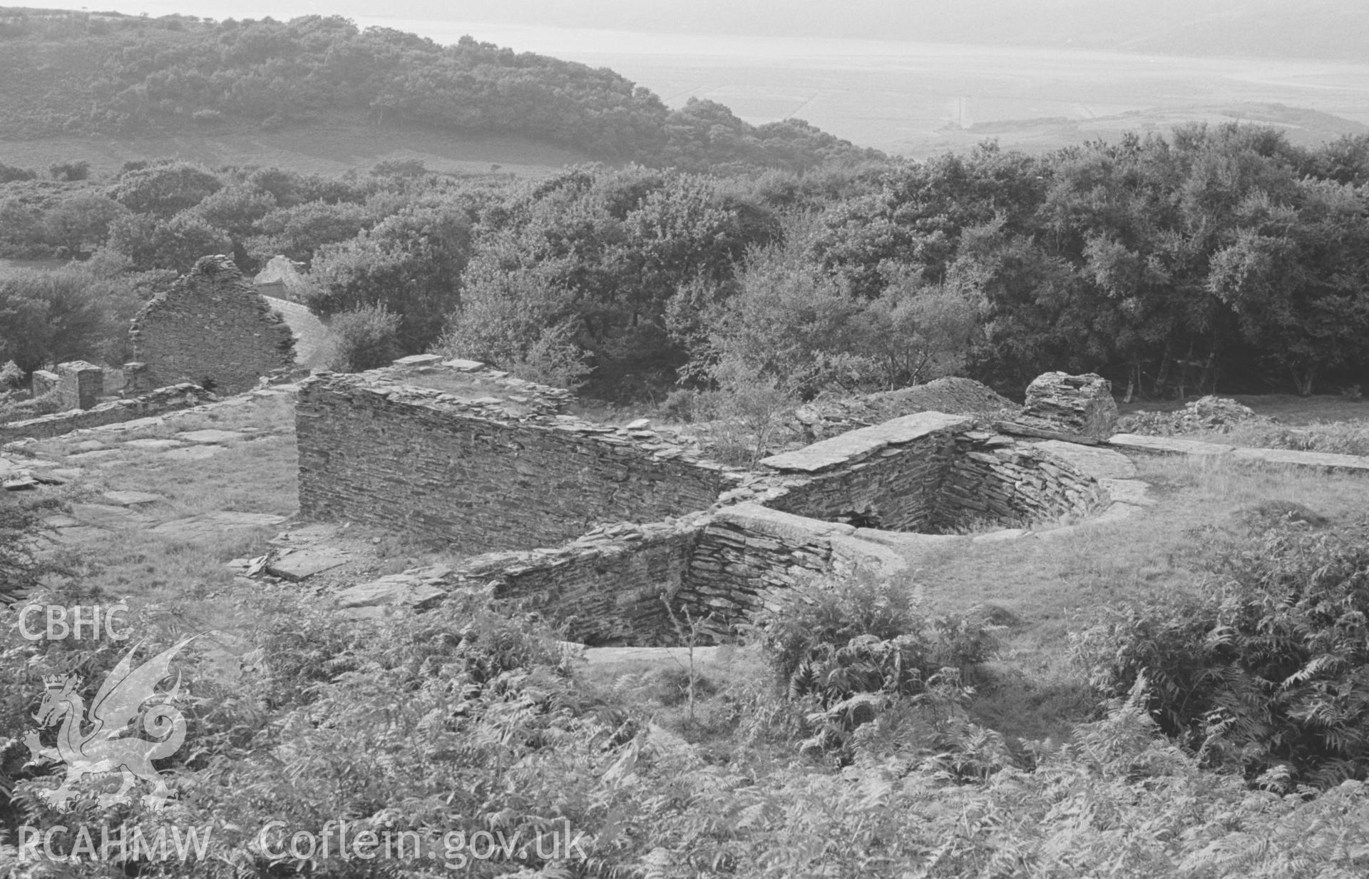 Digital copy of black & white negative showing the twin funnels or chutes at the terminus of the tramway just above the main mine buildings at Bryndyfi Lead Mine. Photographed by Arthur O. Chater in August 1966 looking west from Grid Reference SN 683 934.