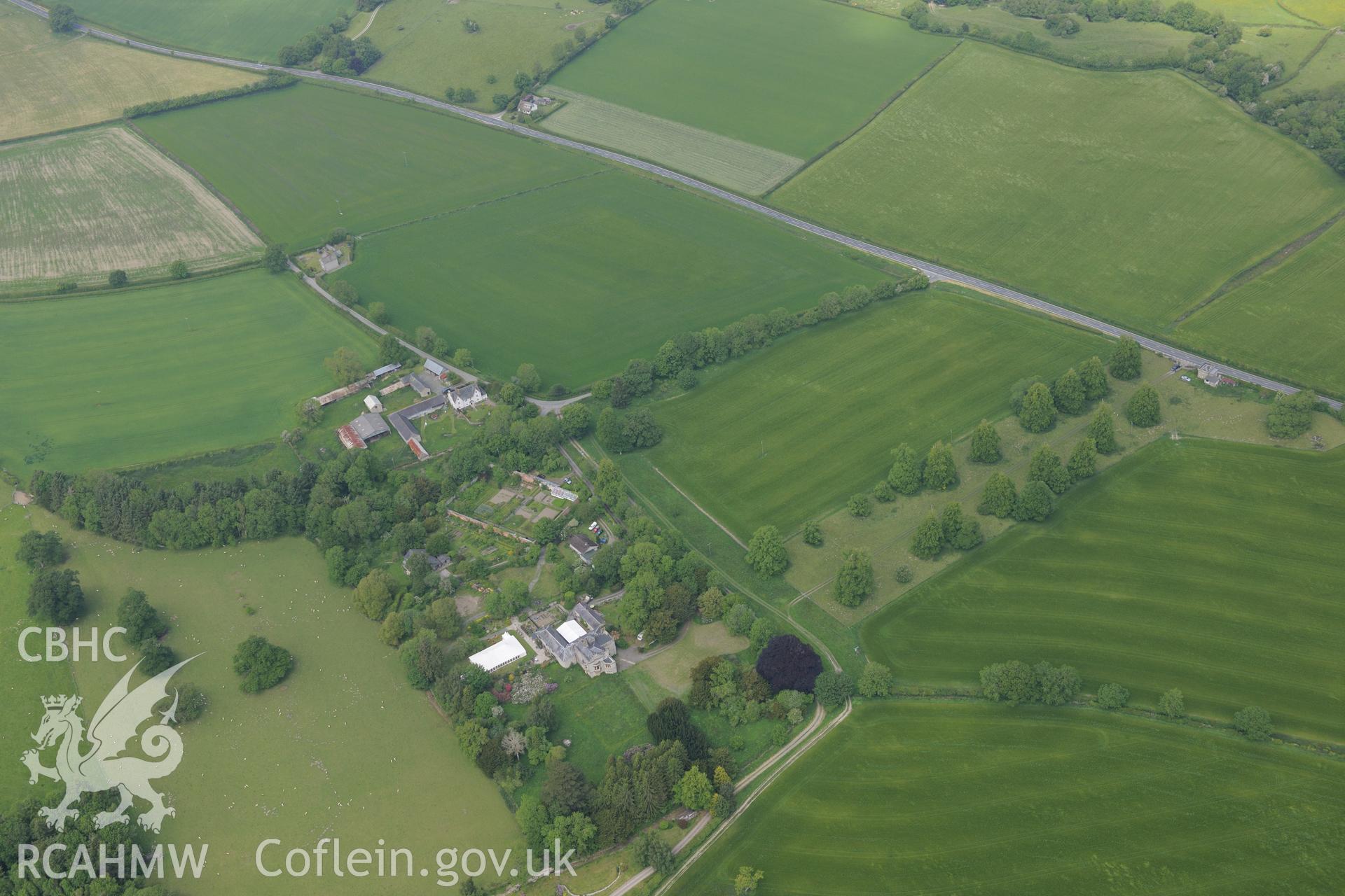 Hampton Court and garden; Hampton Court lodge; Garden House; defended enclosure; parallel linear ditches and Roman fortlet. Oblique aerial photograph taken during the Royal Commission's programme of archaeological aerial reconnaissance by Toby Driver on 11th June 2015.