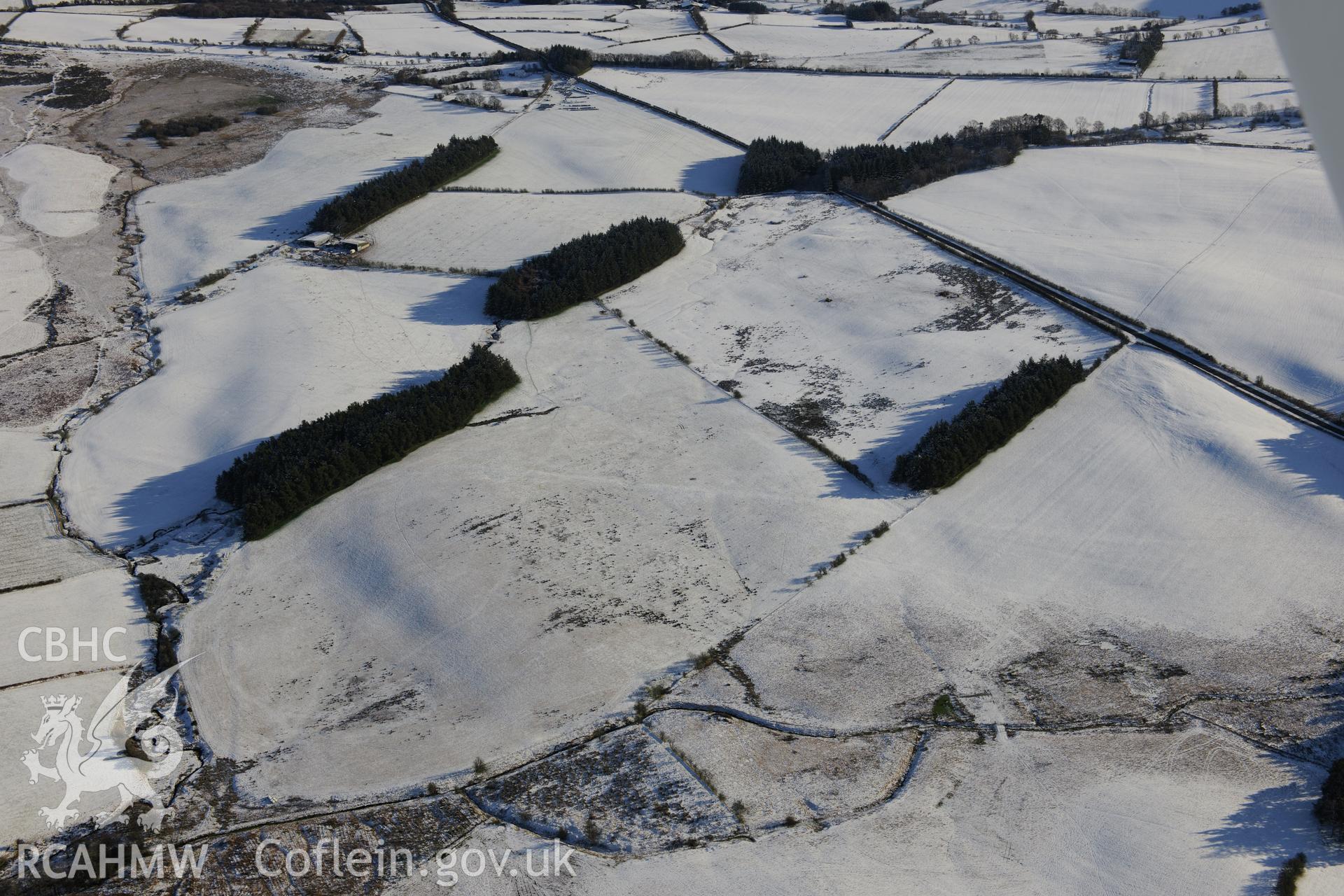 The south western section of the Roman road on Mynydd Illtyd, south west of Brecon. Oblique aerial photograph taken during the Royal Commission?s programme of archaeological aerial reconnaissance by Toby Driver on 15th January 2013.