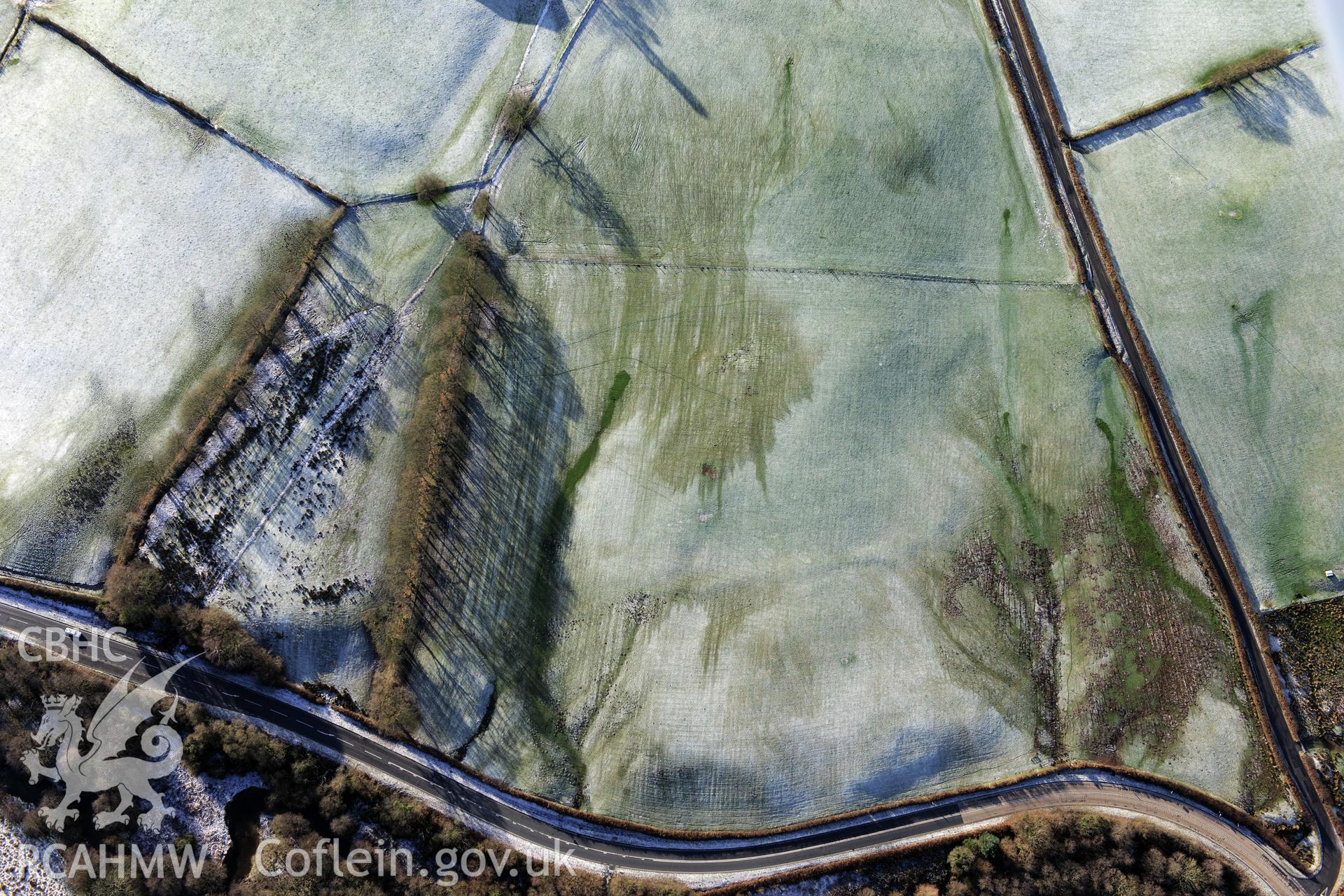 Caerau Roman fort and military settlement, Beulah, west of Builth Wells. Oblique aerial photograph taken during the Royal Commission?s programme of archaeological aerial reconnaissance by Toby Driver on 15th January 2013.