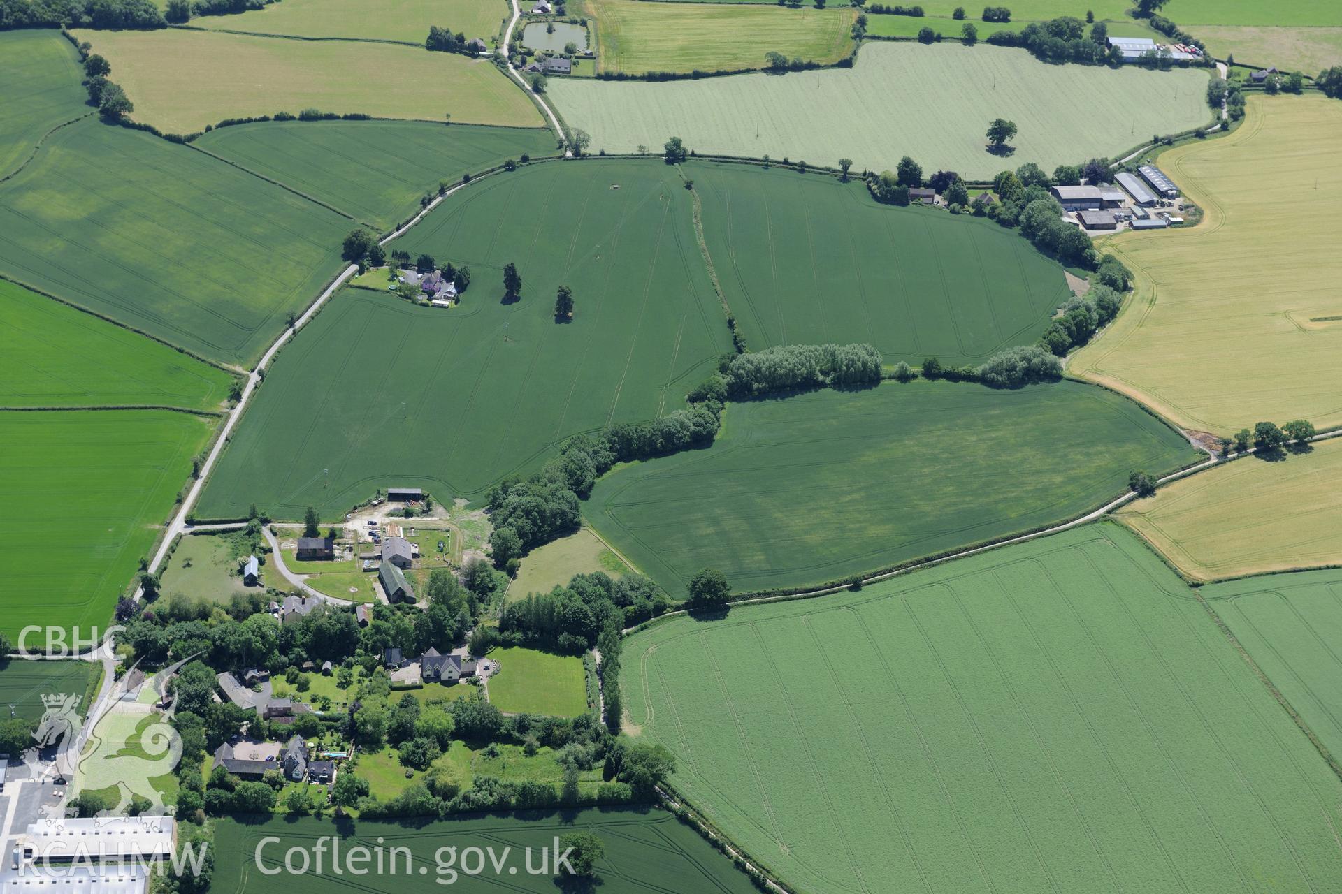 Bacheldre hall, farmhouse and defended enclosure, south of Montgomery. Oblique aerial photograph taken during the Royal Commission's programme of archaeological aerial reconnaissance by Toby Driver on 30th June 2015.