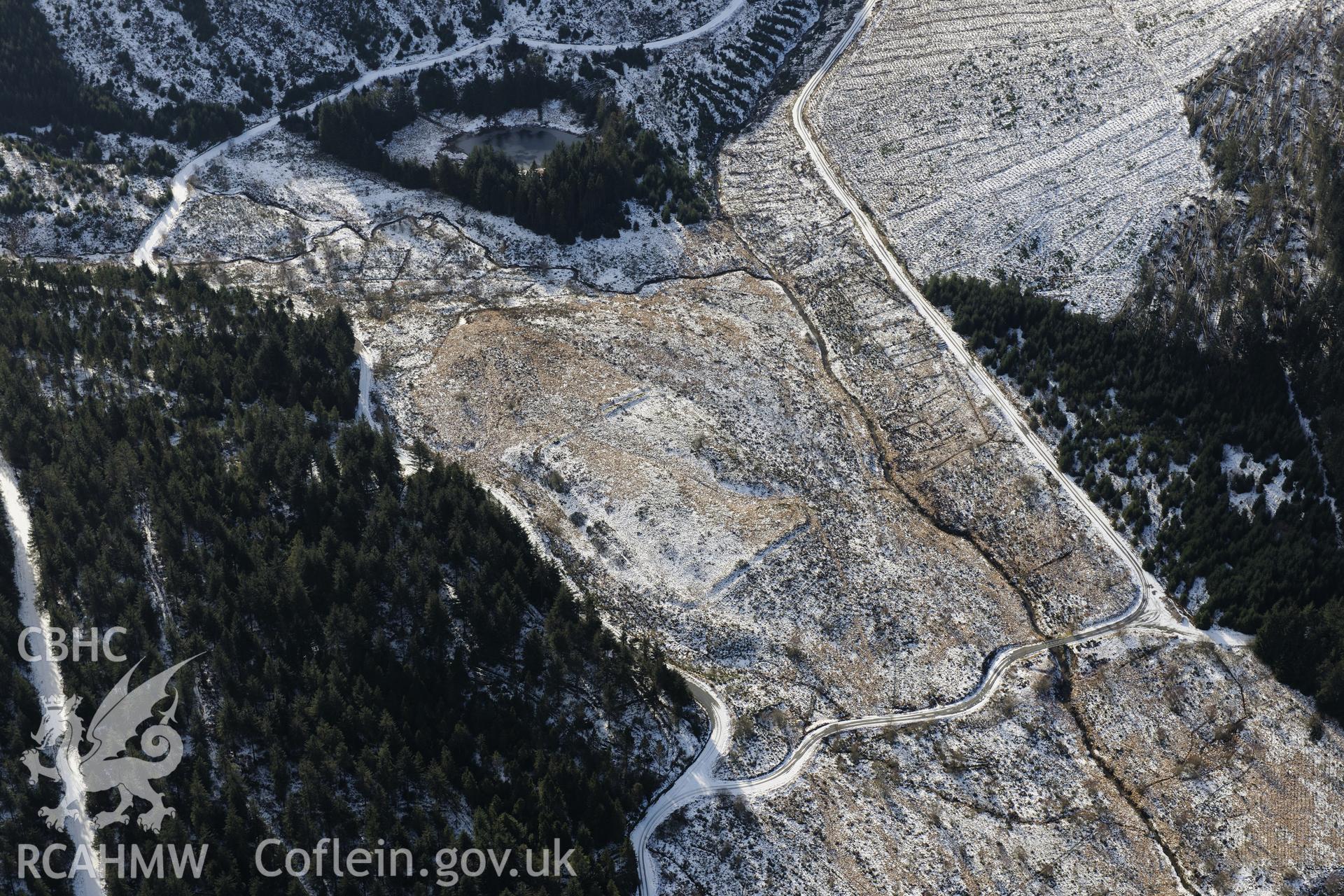 Cae Gaer roman fort, also known as Gorsedd Arthur, west of Llangurig. Oblique aerial photograph taken during the Royal Commission's programme of archaeological aerial reconnaissance by Toby Driver on 4th February 2015.