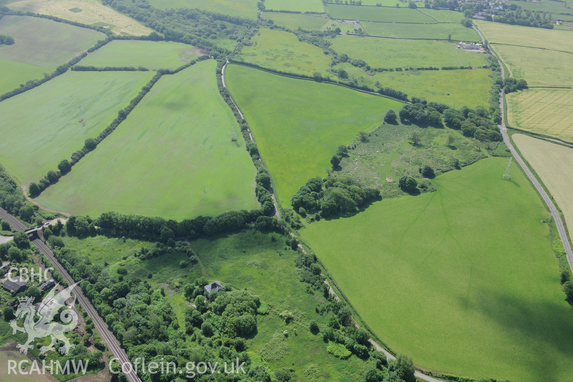 Llangewydd court and the suggested site of Llangewydd castle, near Laleston, Bridgend. Oblique aerial photograph taken during the Royal Commission's programme of archaeological aerial reconnaissance by Toby Driver on 19th June 2015.