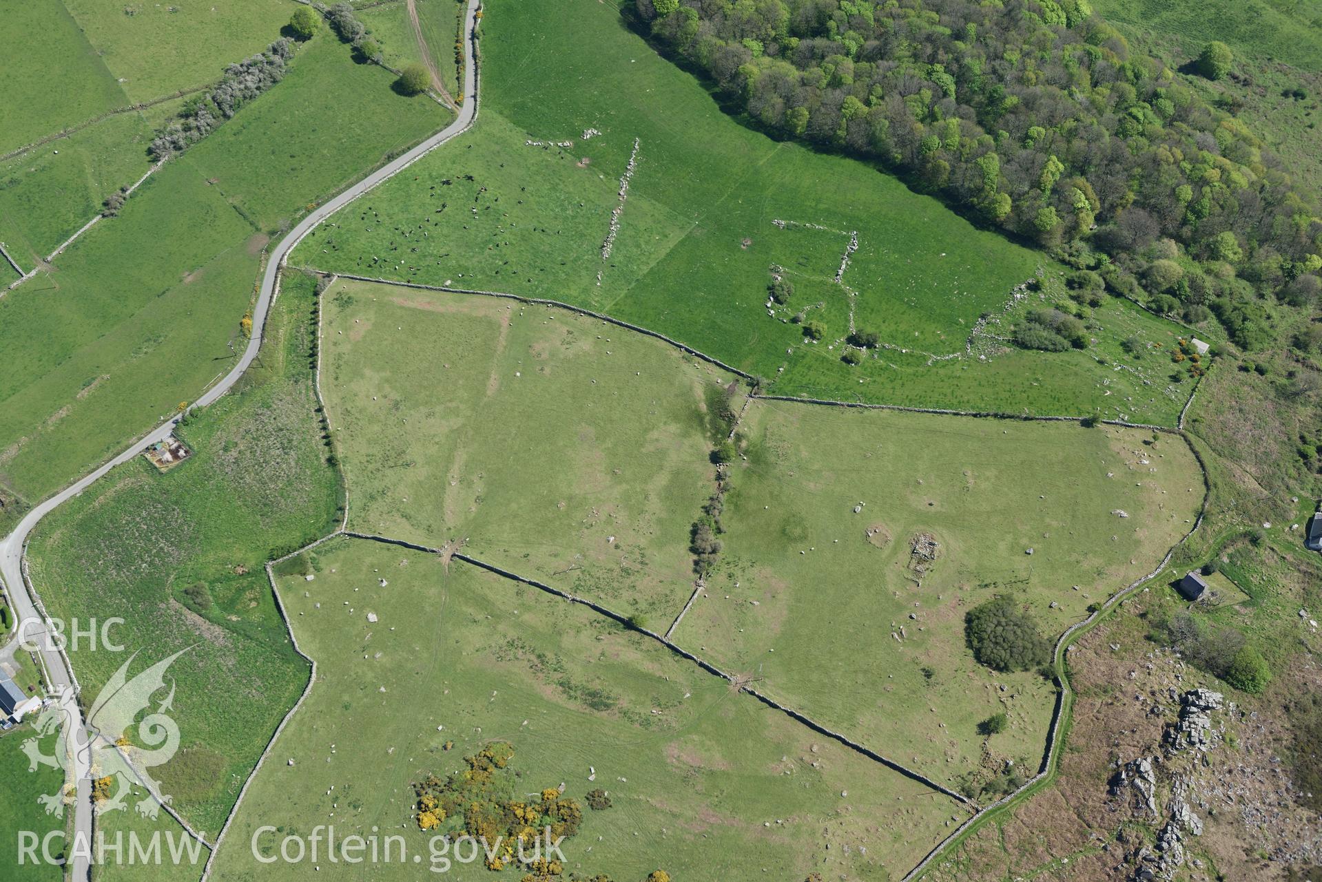 Aerial photography of Hut circle and fields south of Rhiw, taken on 3rd May 2017.  Baseline aerial reconnaissance survey for the CHERISH Project. ? Crown: CHERISH PROJECT 2017. Produced with EU funds through the Ireland Wales Co-operation Programme 2014-2020. All material made freely available through the Open Government Licence.