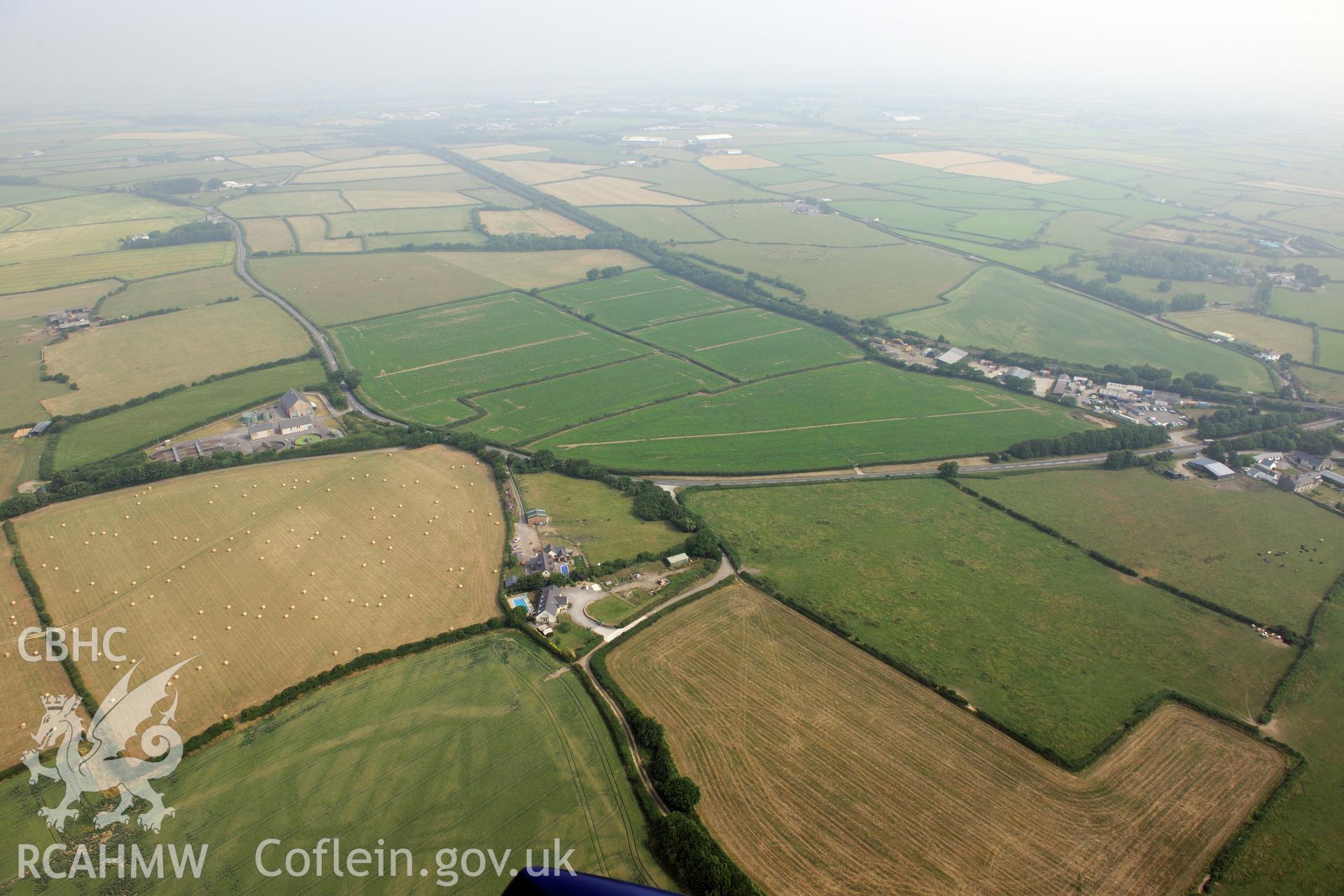 Royal Commission aerial photography of cropmarks at Moorlands Farm recorded during drought conditions on 22nd July 2013 at the time of their discovery.