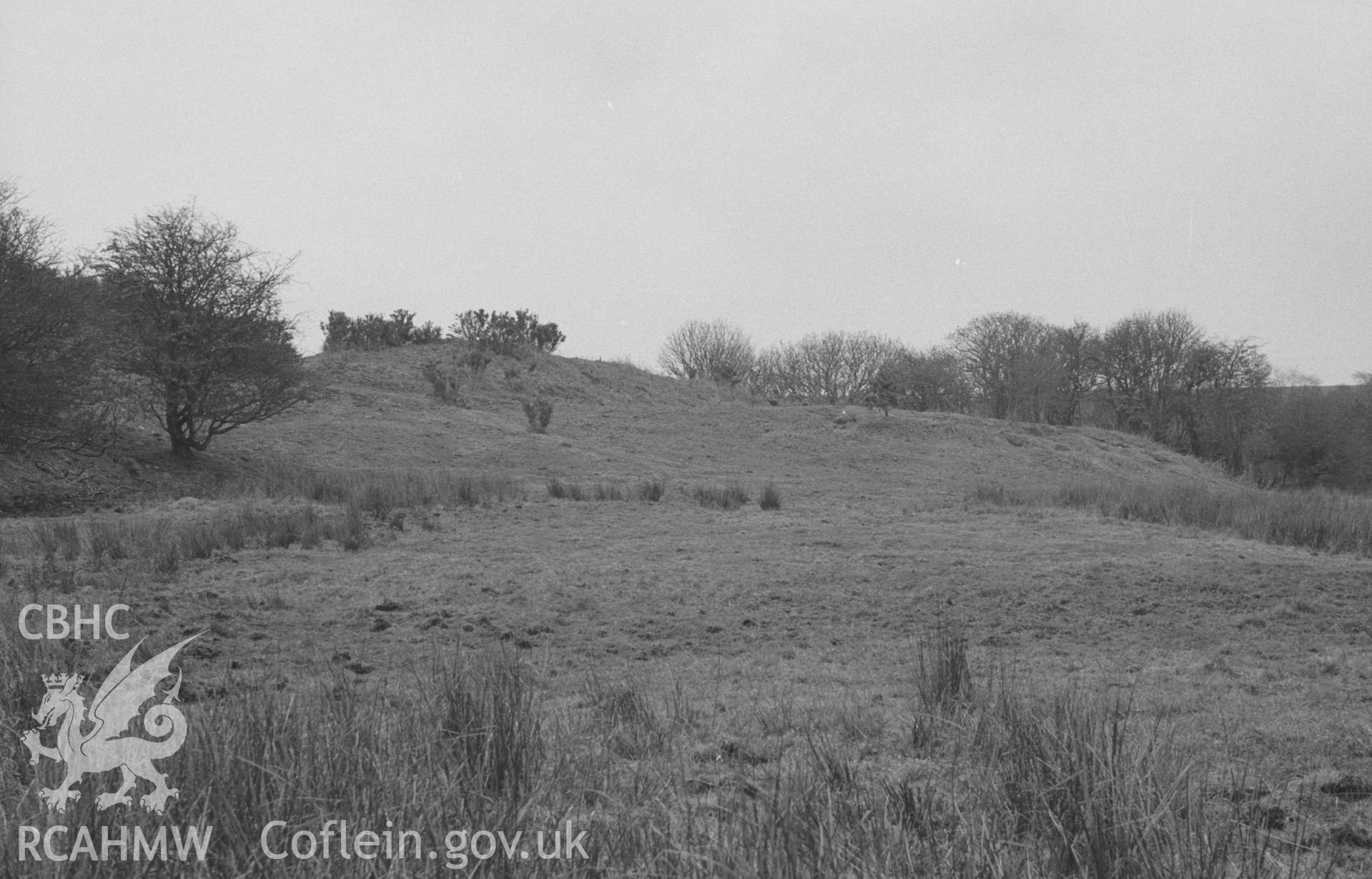 Digital copy of a black and white negative showing main defences of Cwm Castell, Mydriolyn, south east of New Quay. Photographed in April 1964 by Arthur O. Chater from Grid Reference SN 4694 5533, looking east.