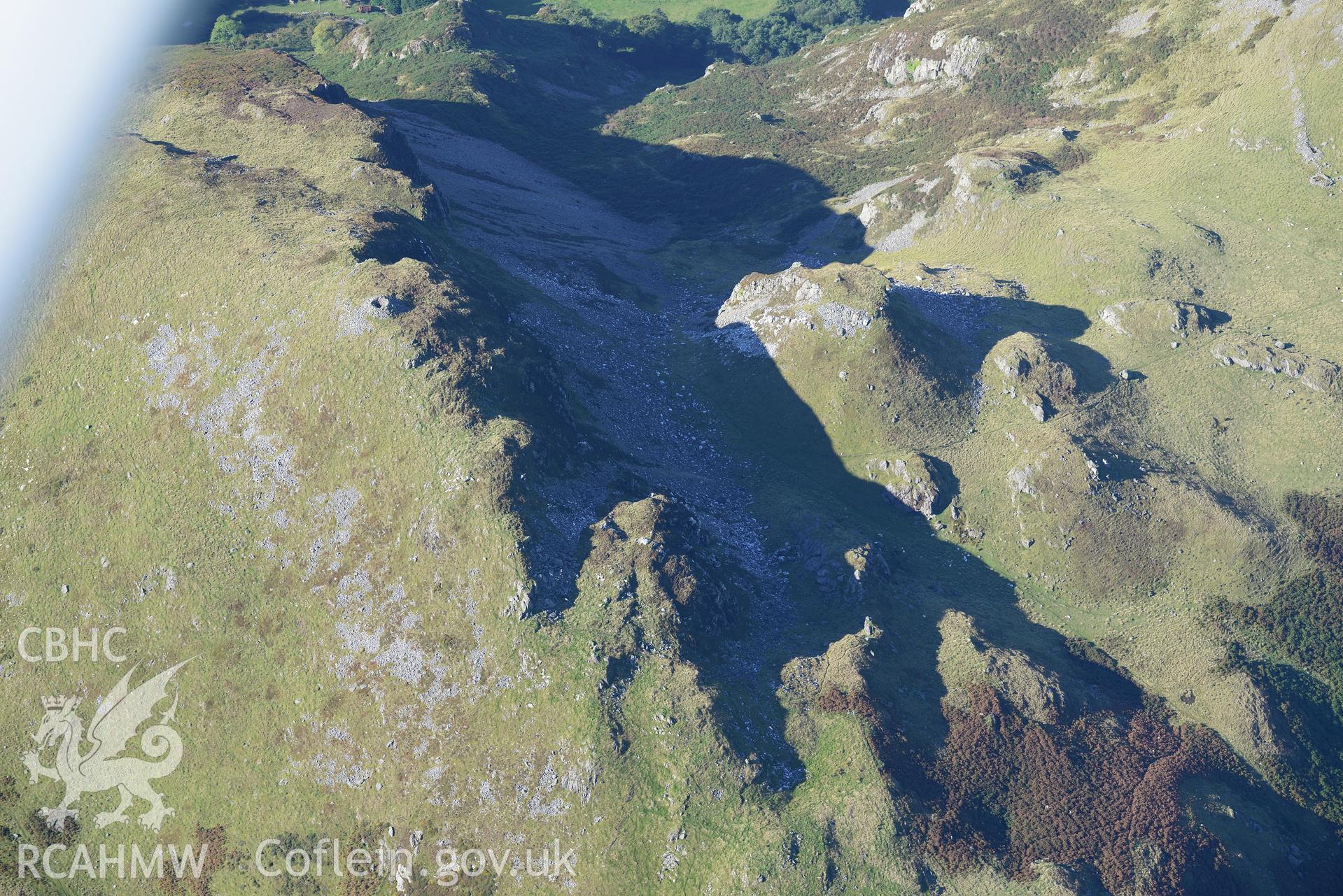 Craig yr Aderyn cairn, and a crag to its east, near Abergynolwyn. Oblique aerial photograph taken during the Royal Commission's programme of archaeological aerial reconnaissance by Toby Driver on 2nd October 2015.