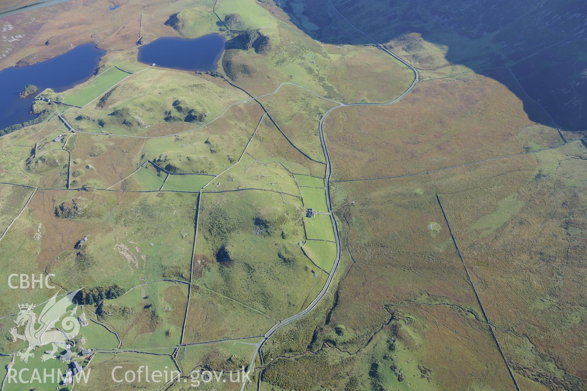 Hafotty Fach ruined house, clearance & cultivation northwest of the house, and Llynnau Cregennen, near Fairbourne. Oblique aerial photograph taken during the Royal Commission's programme of archaeological aerial reconnaissance by Toby Driver on 2 Oct 2015.