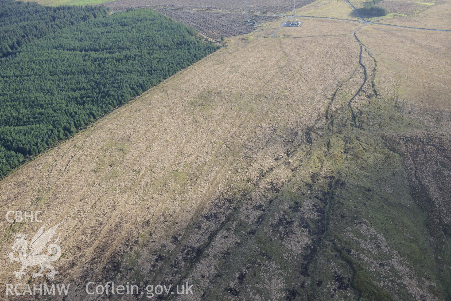 Crugiau Edryd, Cairns I - IV. Oblique aerial photograph taken during the Royal Commission's programme of archaeological aerial reconnaissance by Toby Driver on 6th January 2015.