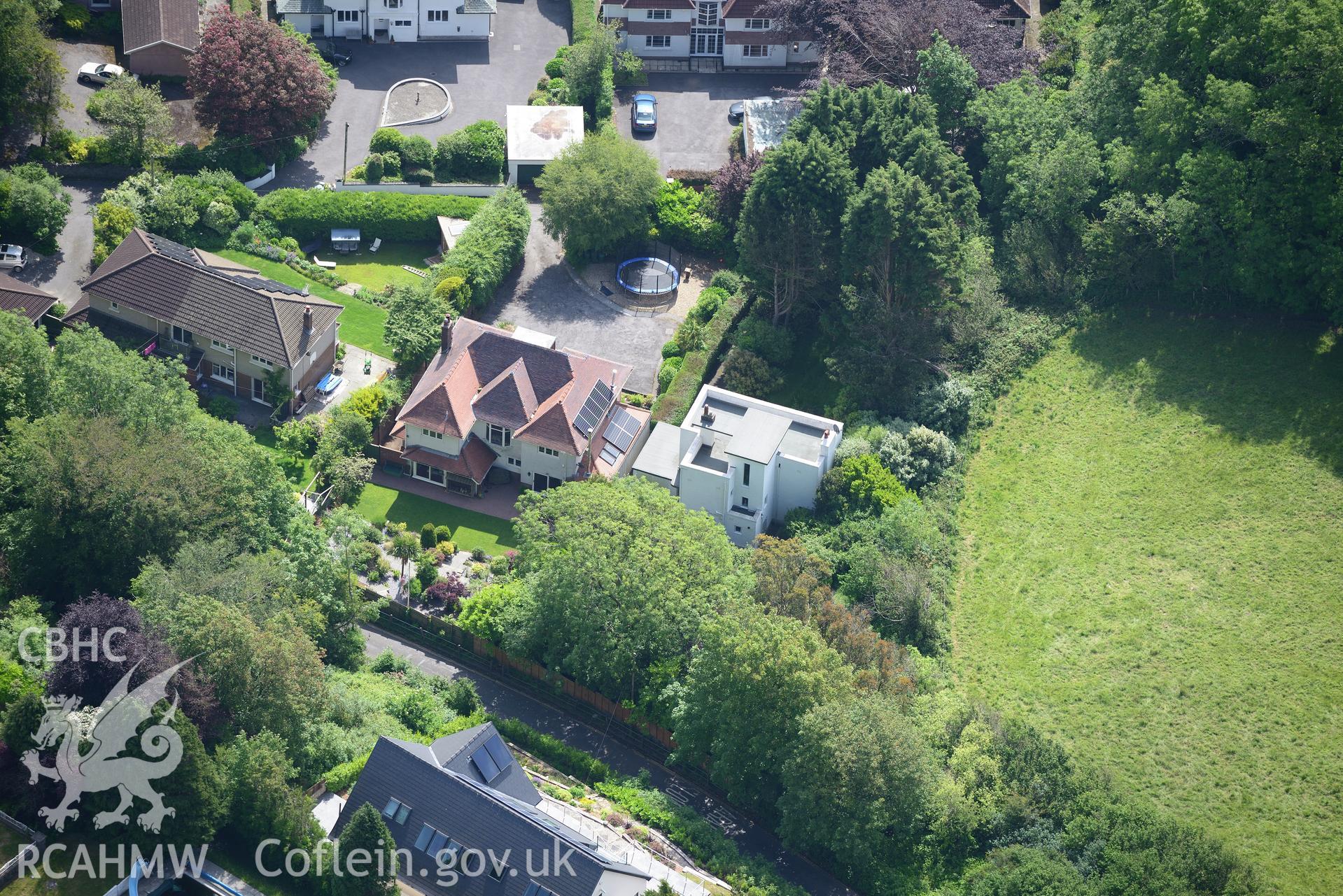 Housing at Caswell Bay. Oblique aerial photograph taken during the Royal Commission's programme of archaeological aerial reconnaissance by Toby Driver on 19th June 2015.