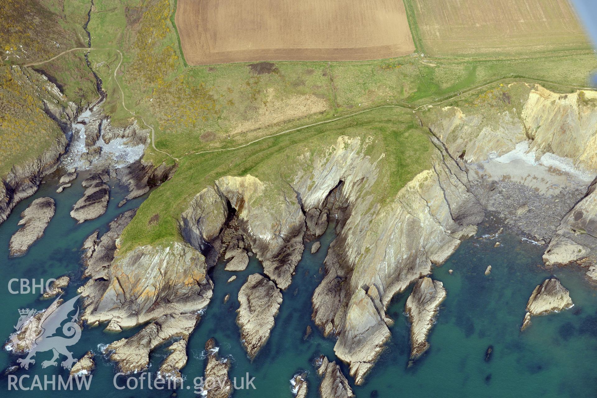 Aerial photography of Porth y Rhaw promontory fort taken on 27th March 2017 for structure from motion recording. Baseline aerial reconnaissance survey for the CHERISH Project. ? Crown: CHERISH PROJECT 2019. Produced with EU funds through the Ireland Wales Co-operation Programme 2014-2020. All material made freely available through the Open Government Licence.