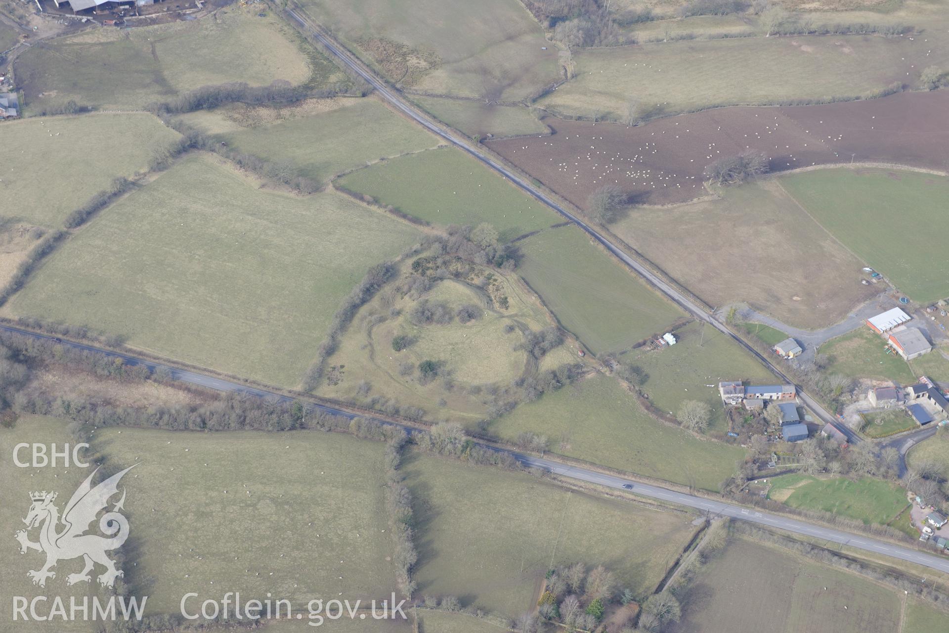 Tomen-y-Rhodwydd motte and bailey, Llandegla, south east of Ruthin. Oblique aerial photograph taken during the Royal Commission?s programme of archaeological aerial reconnaissance by Toby Driver on 28th February 2013.