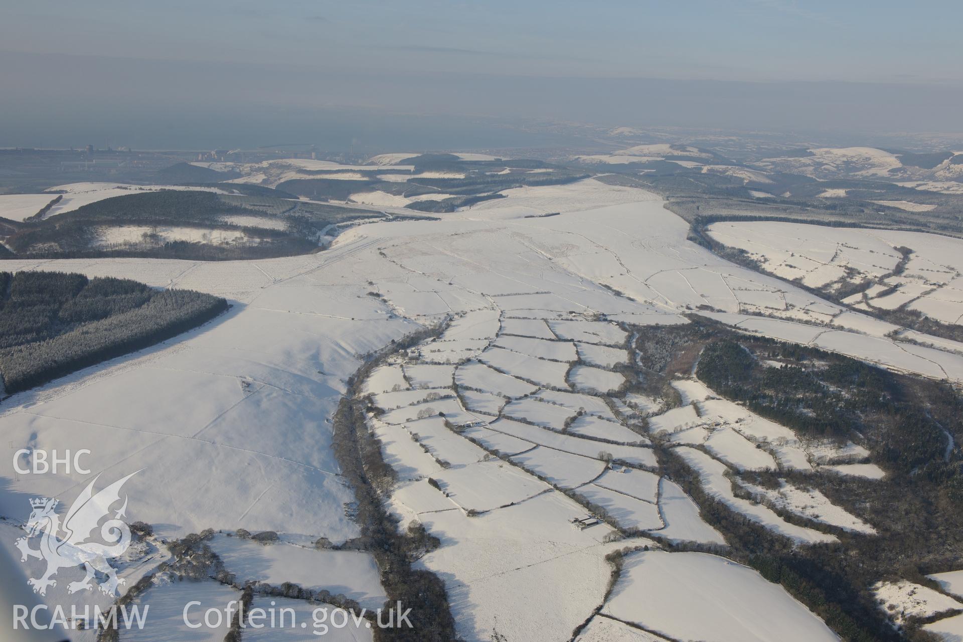 Landscape view of land around Gilfach Ganol Farmstead, east of Margam and south of Maesteg. Oblique aerial photograph taken during the Royal Commission?s programme of archaeological aerial reconnaissance by Toby Driver on 24th January 2013.