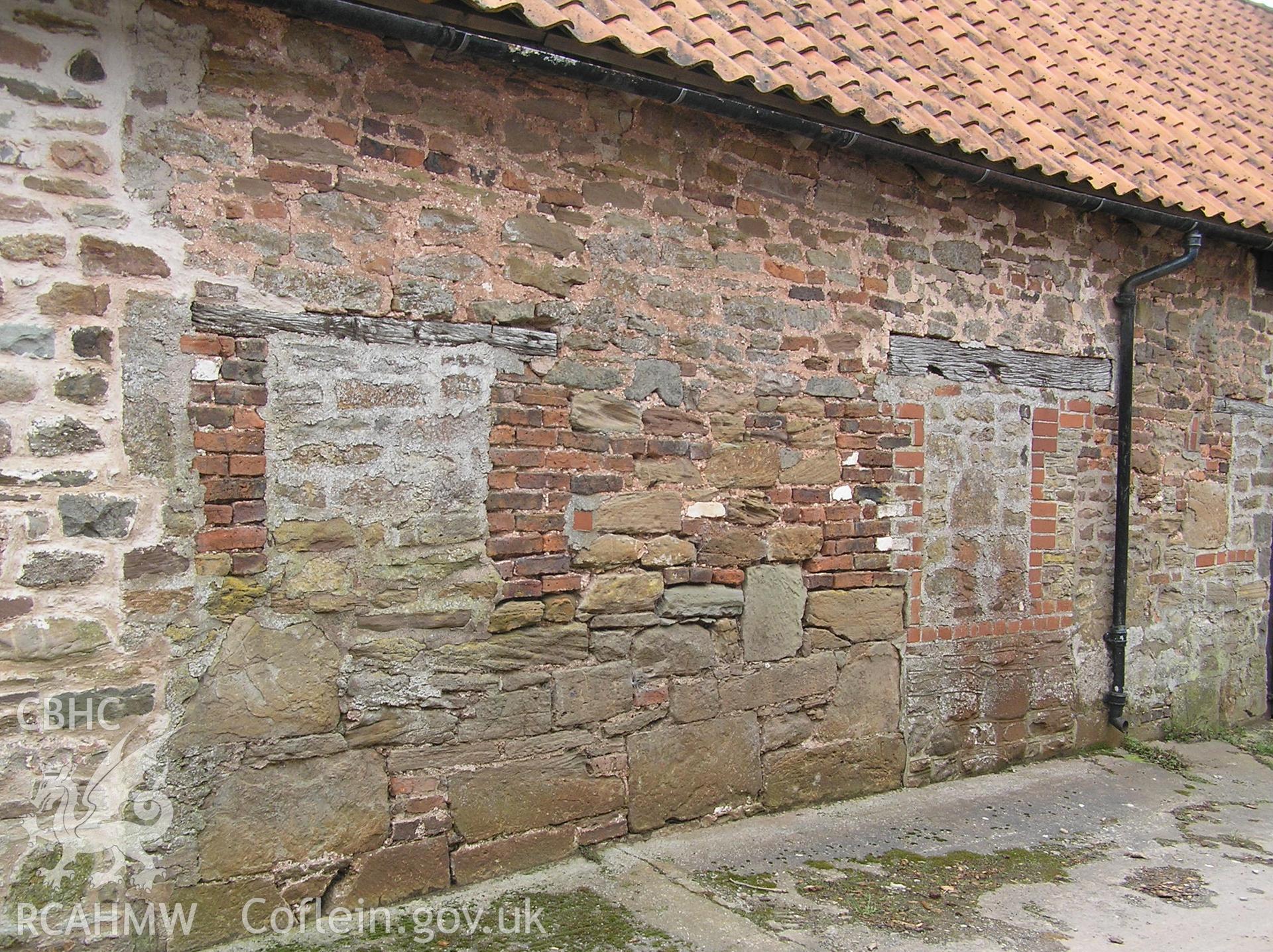 Colour photo showing detail of the east elevation of the cowhouse at Treowen, taken by John Wheelock and donated as a condition of planning consent.